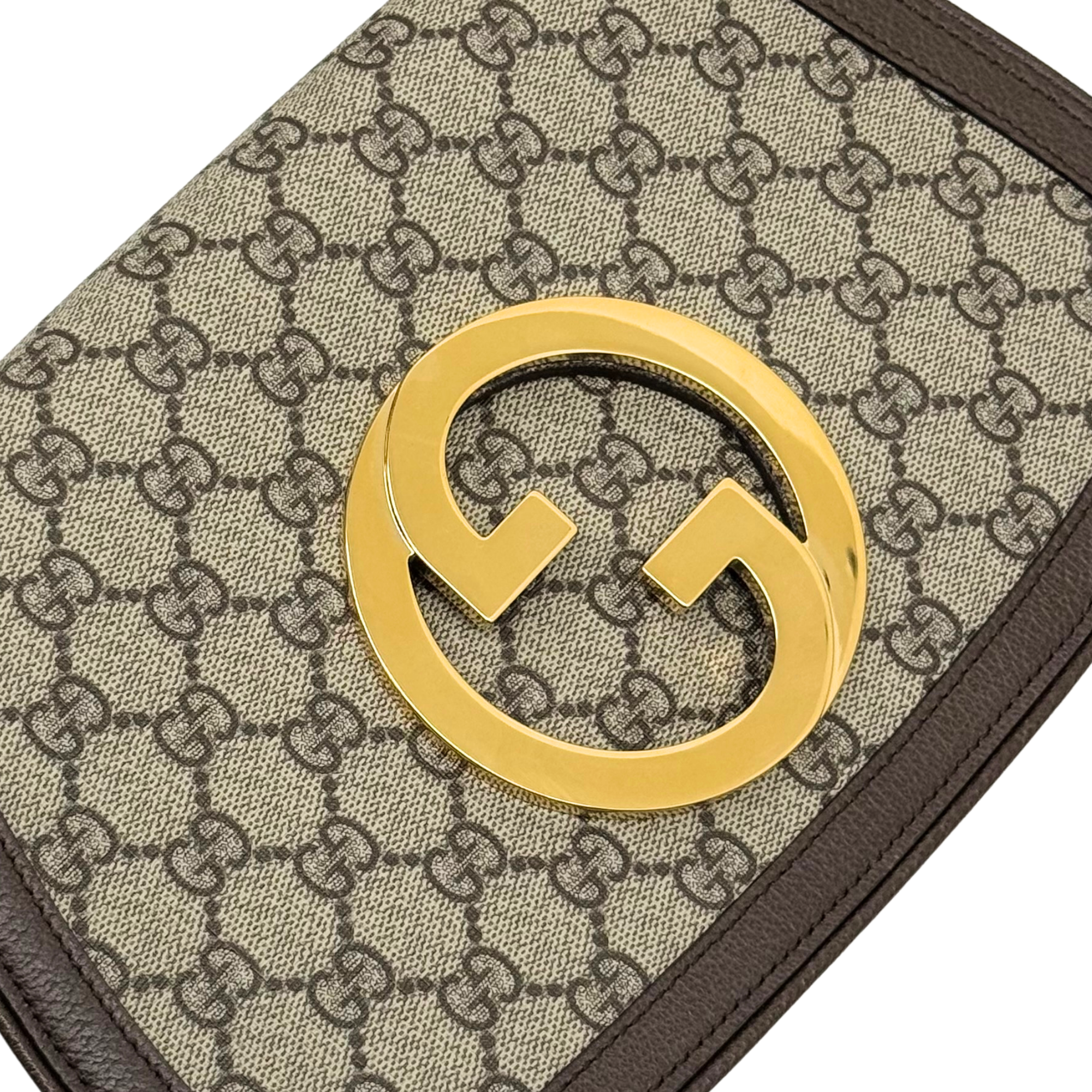 Gucci GG canvas shoulder bag with gold double-G logo clasp and brown leather trim