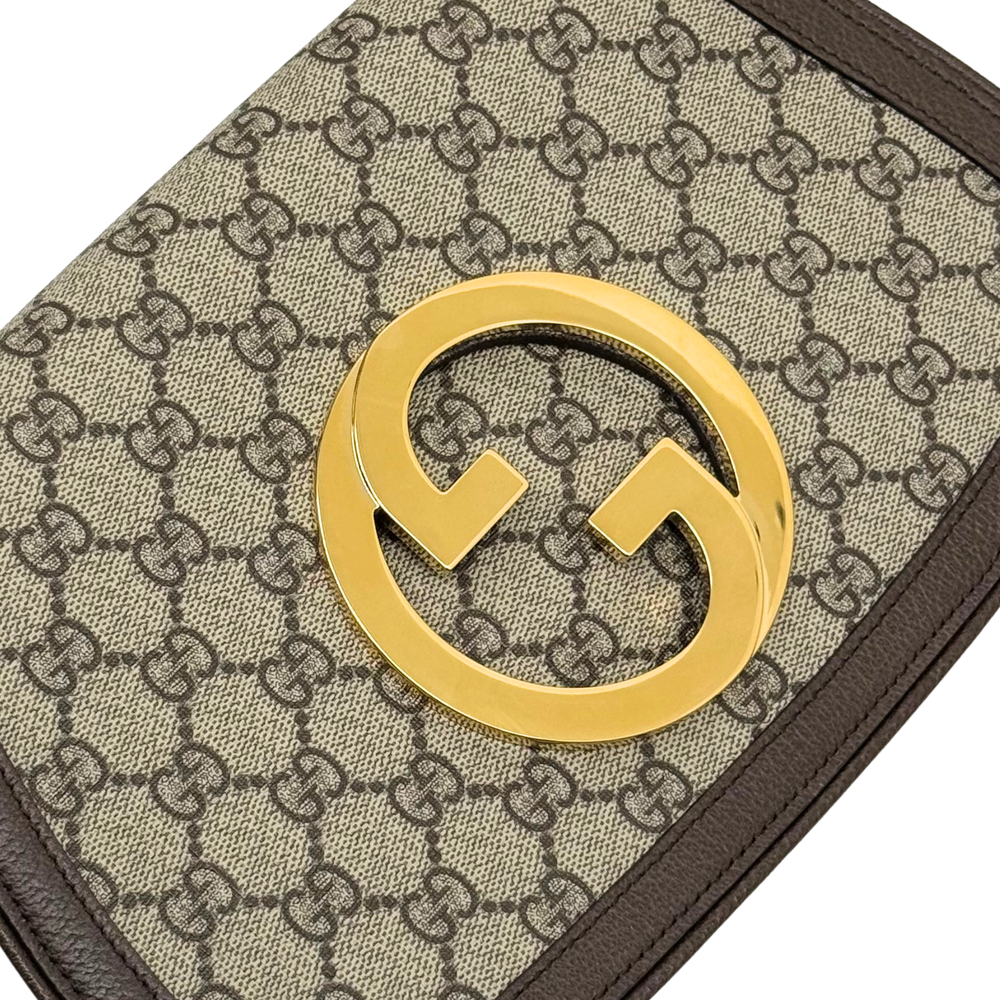 Gucci GG canvas shoulder bag with gold double-G logo clasp and brown leather trim