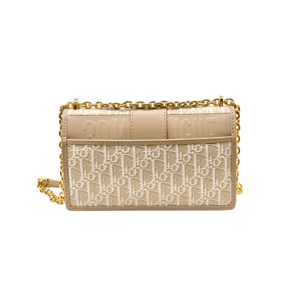 Pre-owned Dior mini bag, beige monogram front with gold chain strap and flap closure