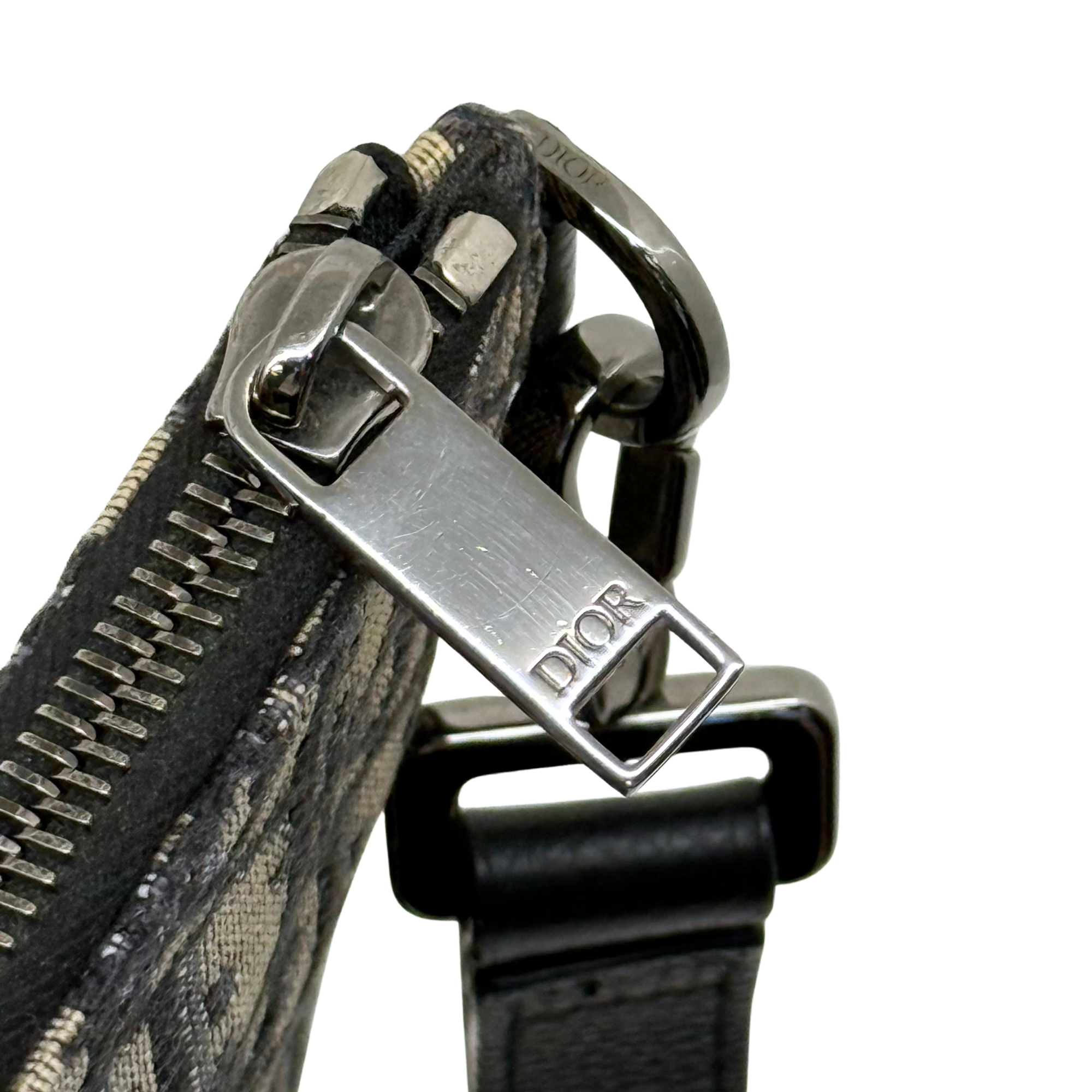 Dior pre-owned zipper pull and metal hardware on patterned canvas with black strap