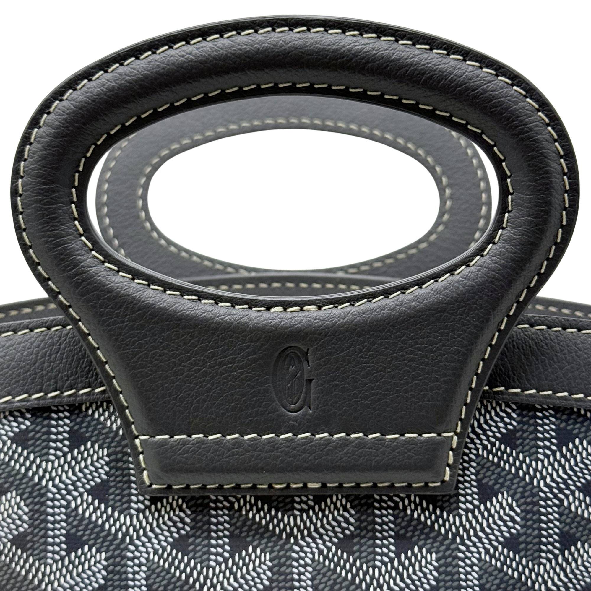 Pre-owned Goyard bag front handle mount with stitched black leather tab and emblem