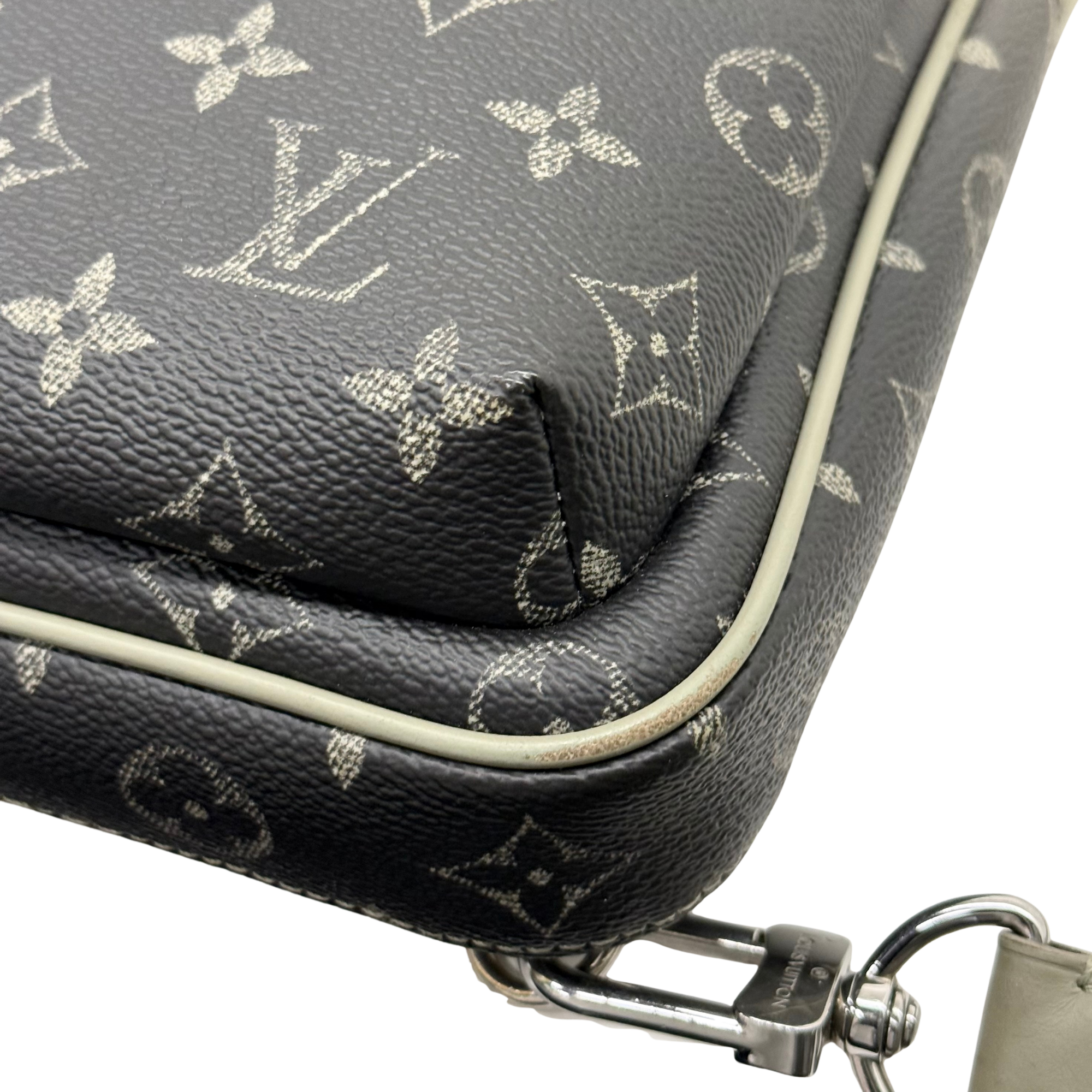 Louis Vuitton monogram crossbody bag front detail with trim edge and metal clasp