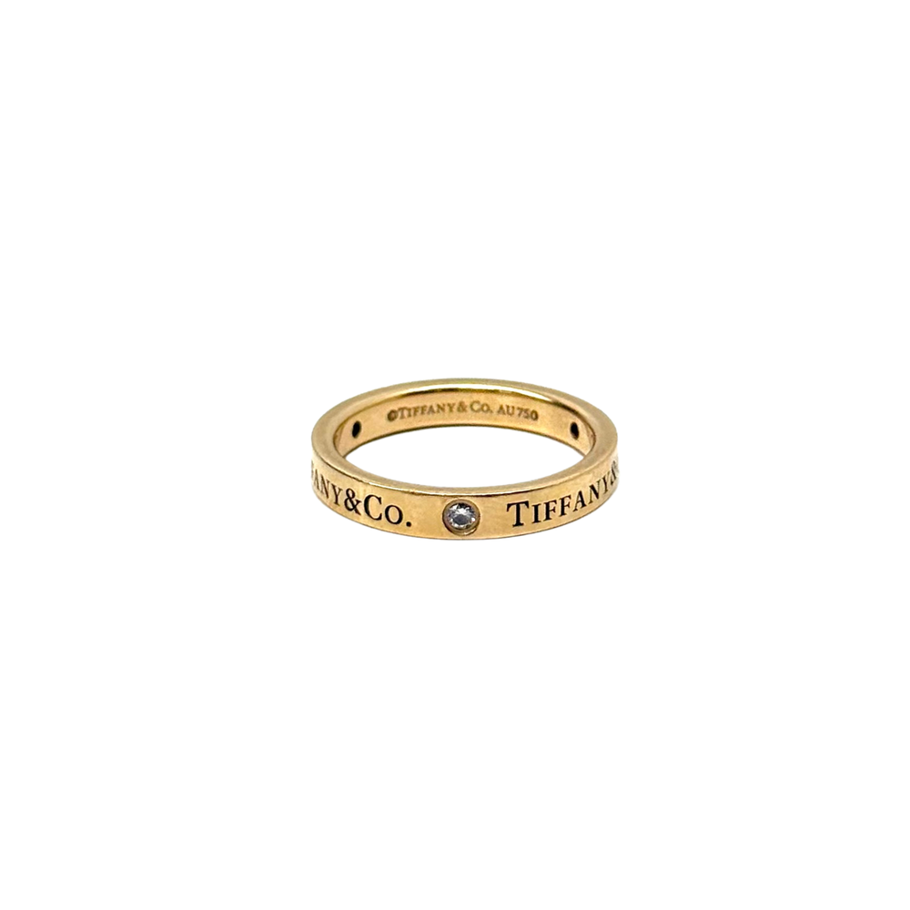 Pre-owned Tiffany & Co. yellow gold band ring with blue gemstone and AU750 stamp