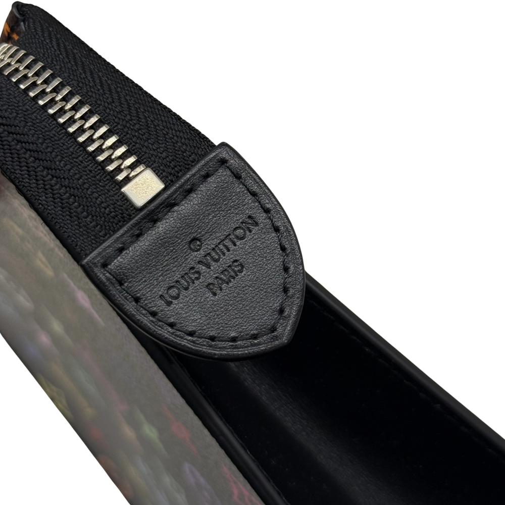 Louis Vuitton zipper pull and stitched label on black leather pouch