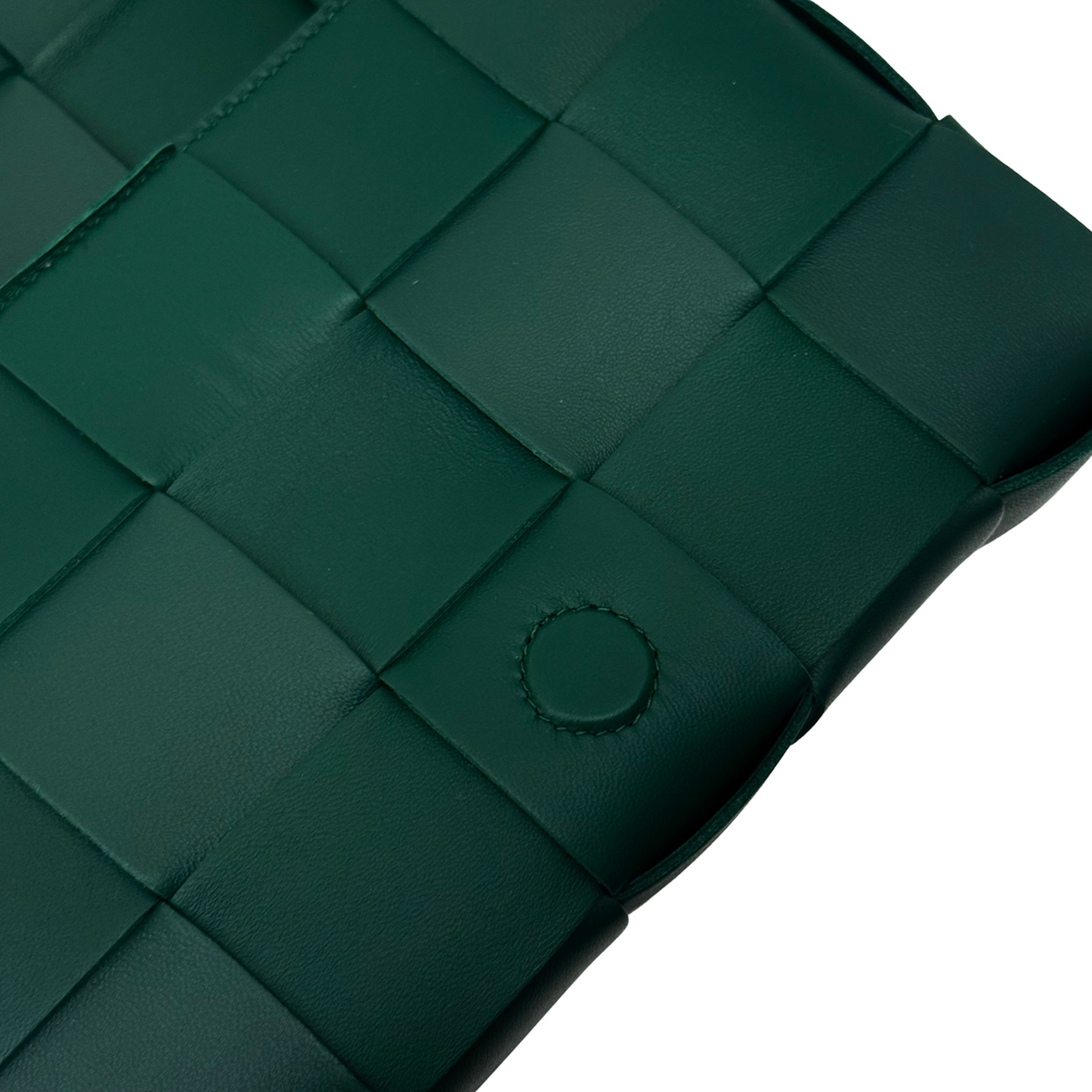 Green woven leather texture with round snap on front panel