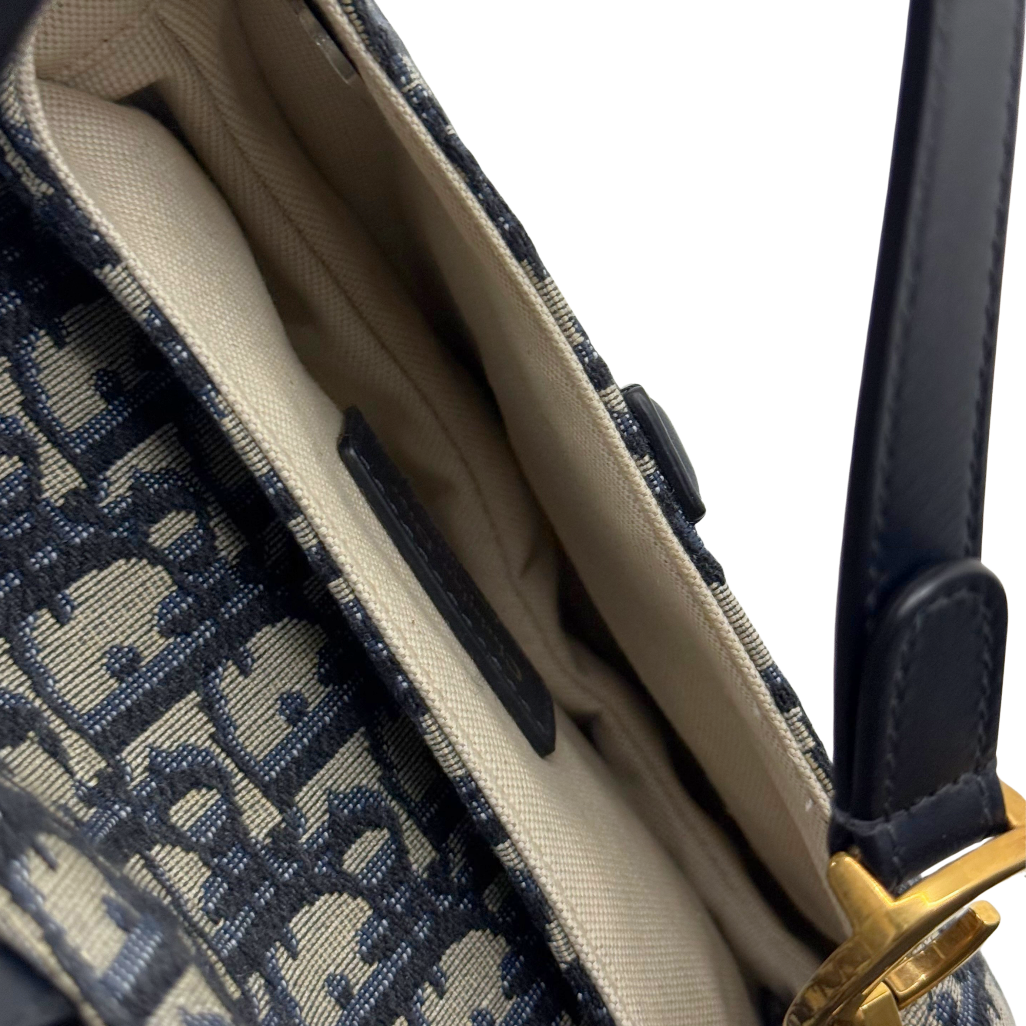 Mini bag interior lining with logo fabric and black leather side panel