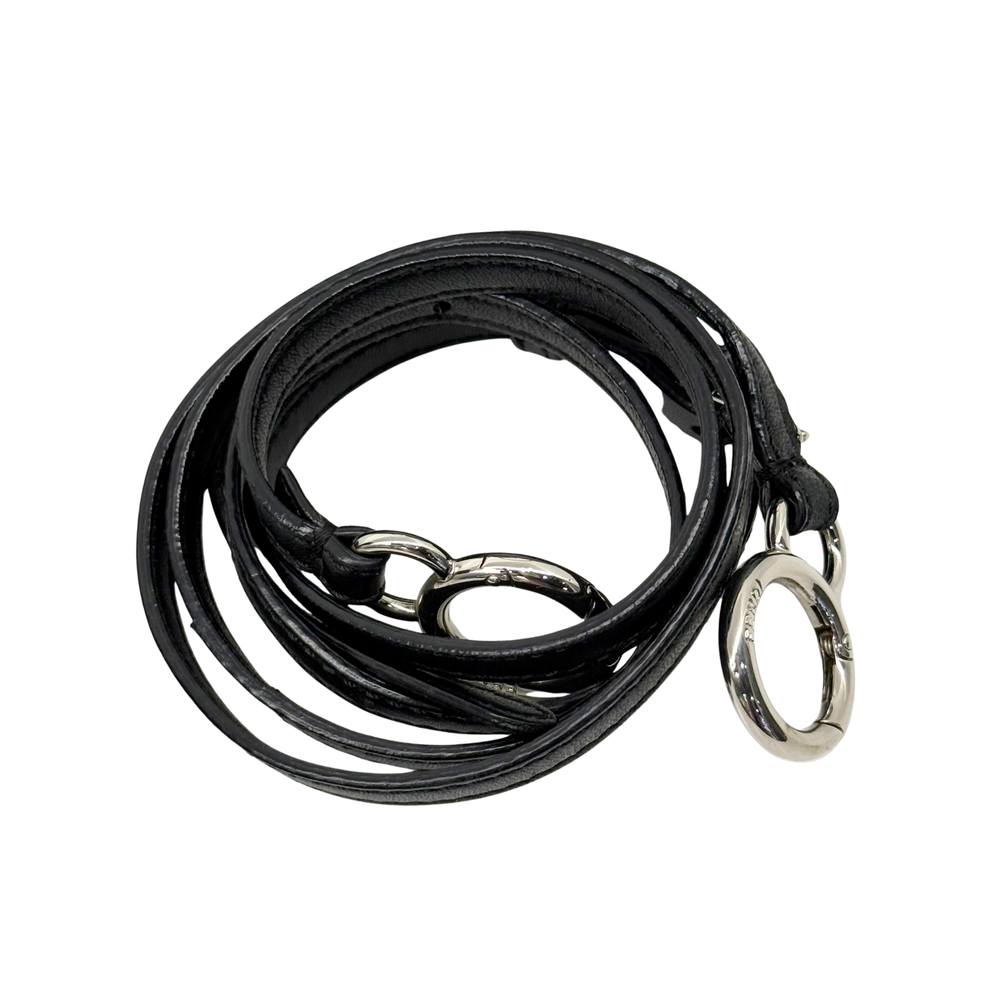 Black leather crossbody strap with silver rings