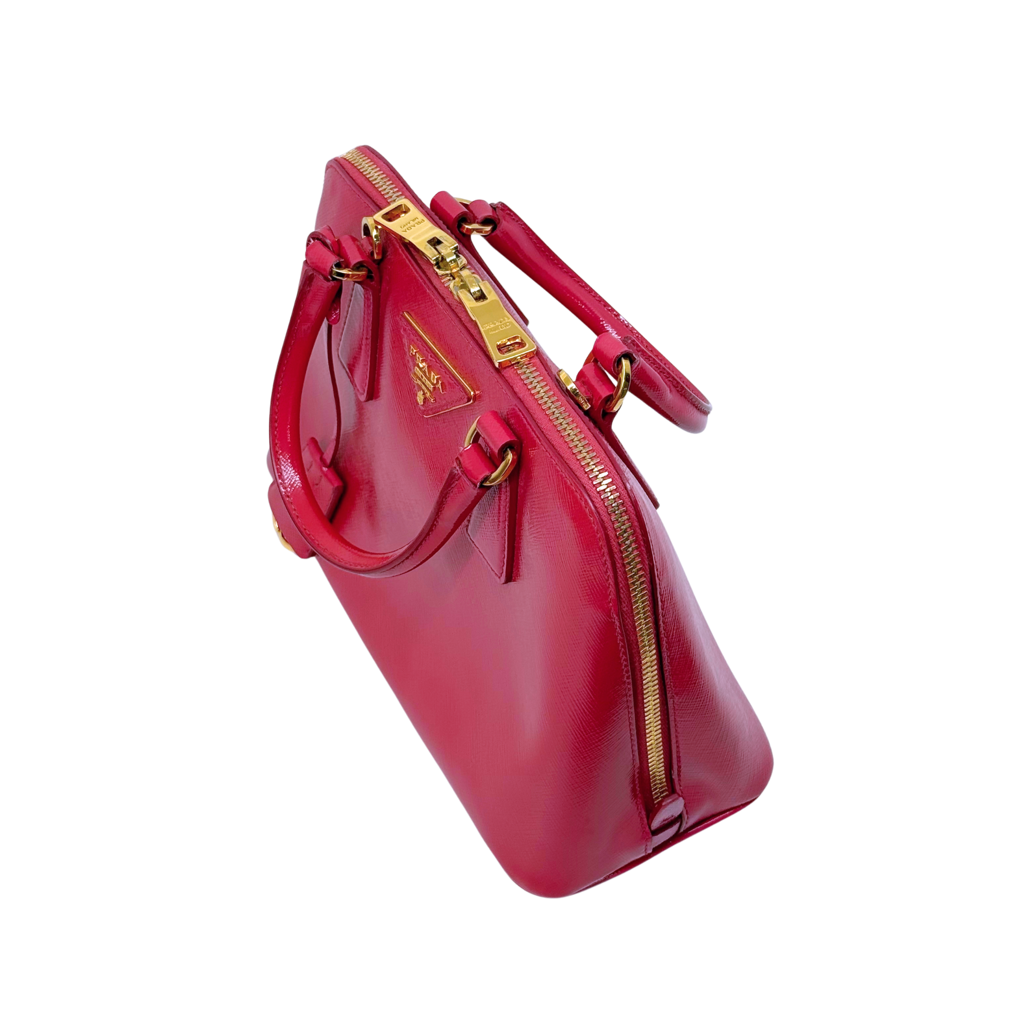 Prada pink handbag side view with dual zippers and crossbody strap