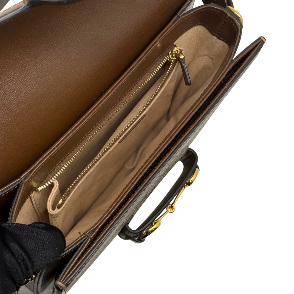 Pre-owned Gucci bag interior view with zipper pocket and tan lining