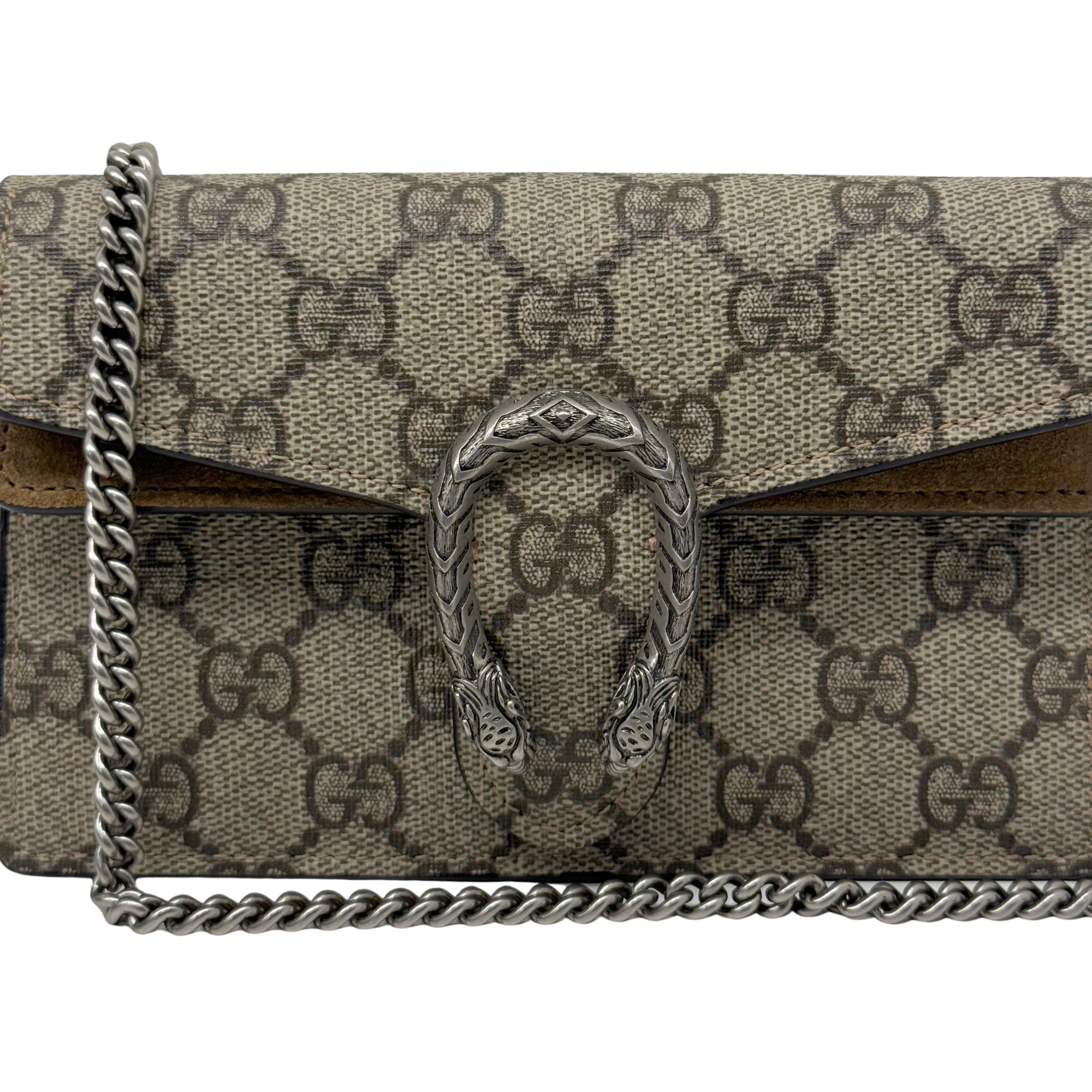 Gucci GG canvas flap with engraved lion-head clasp and silver-tone chain