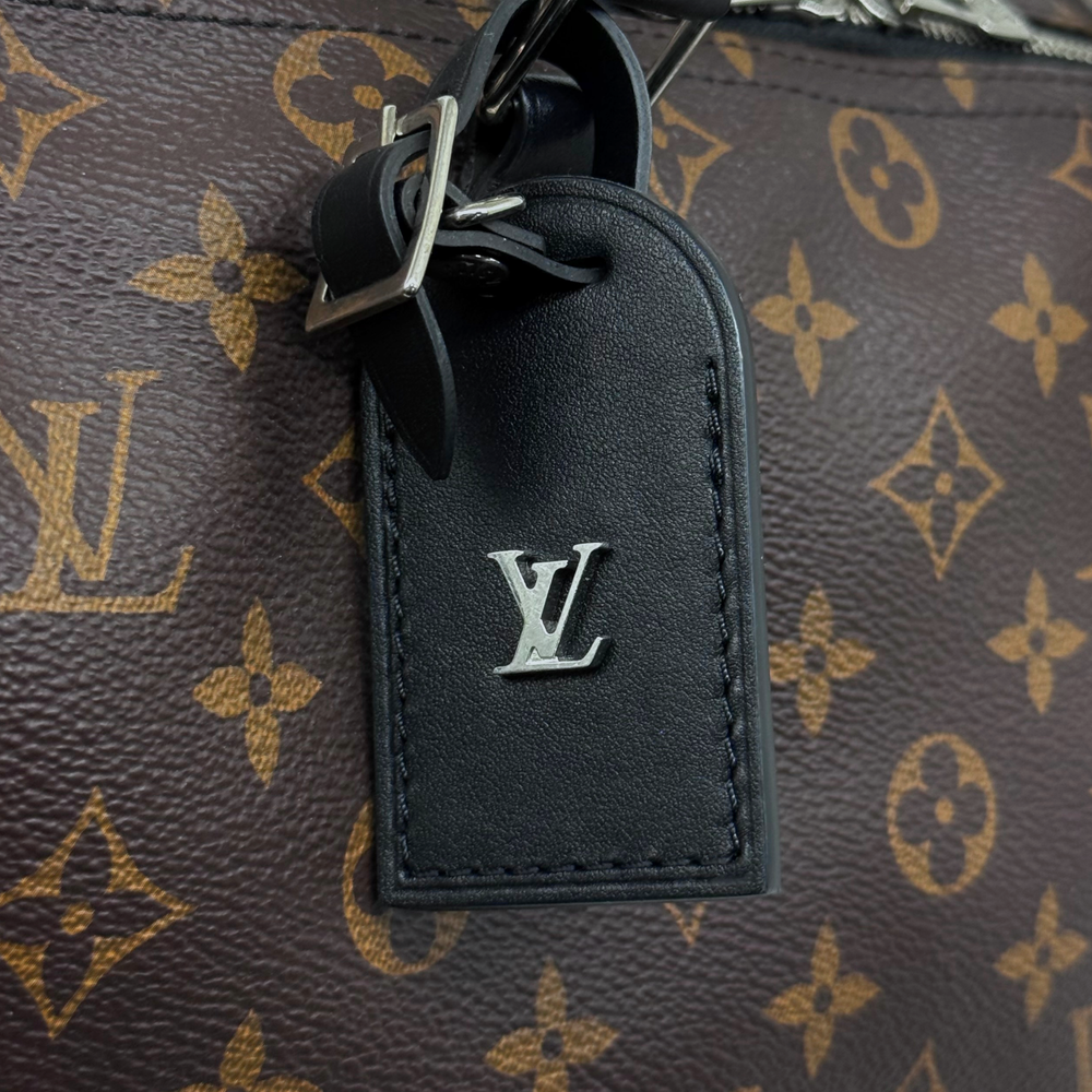 Pre-owned Louis Vuitton handbag key fob with black leather tab and LV logo