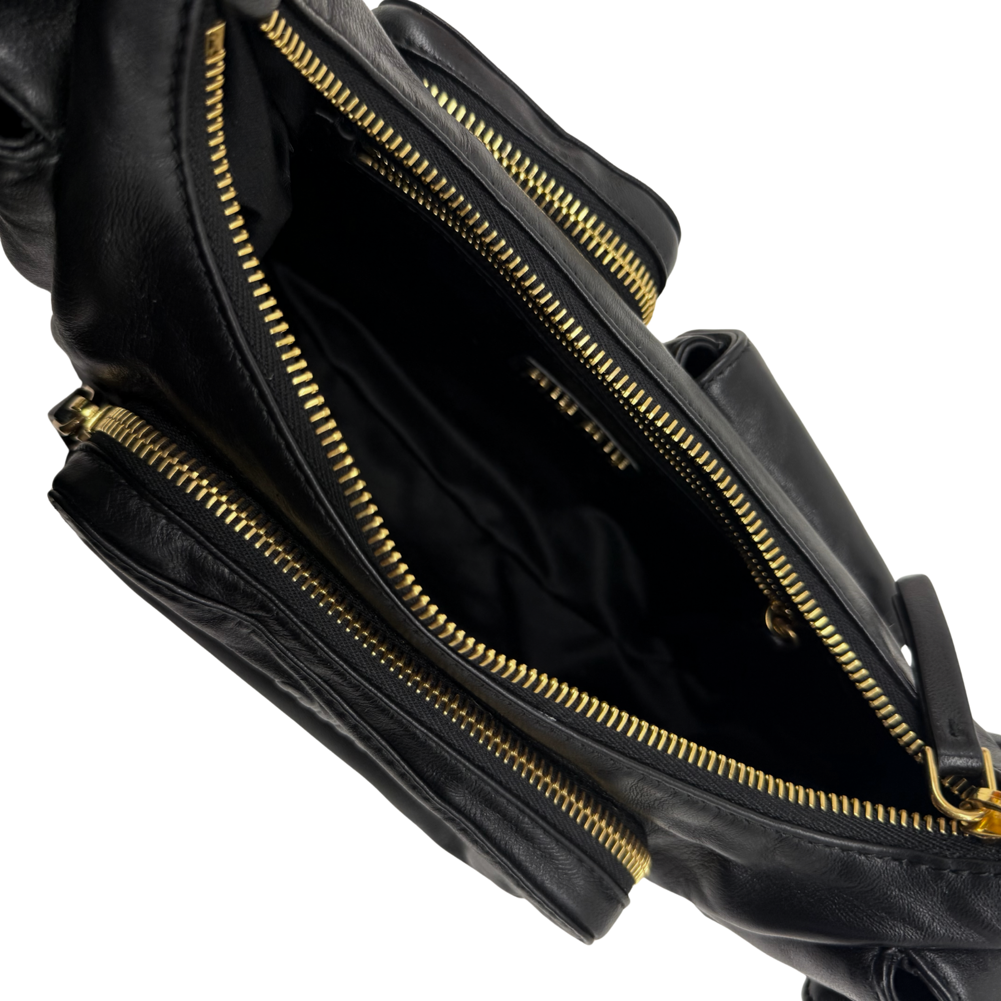 Black leather shoulder bag with open interior and multiple gold zippers
