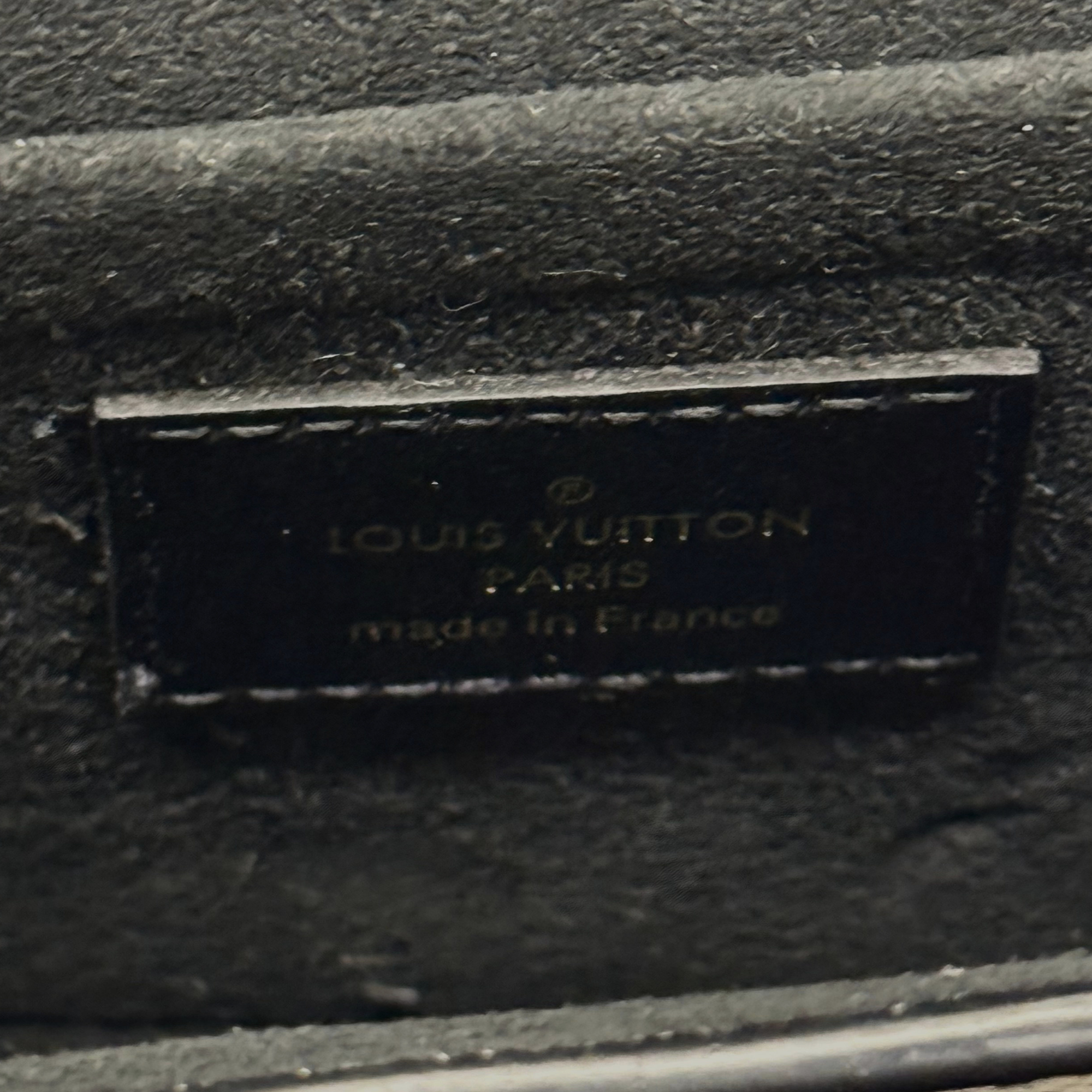Interior stamp label reading Louis Vuitton and made in France