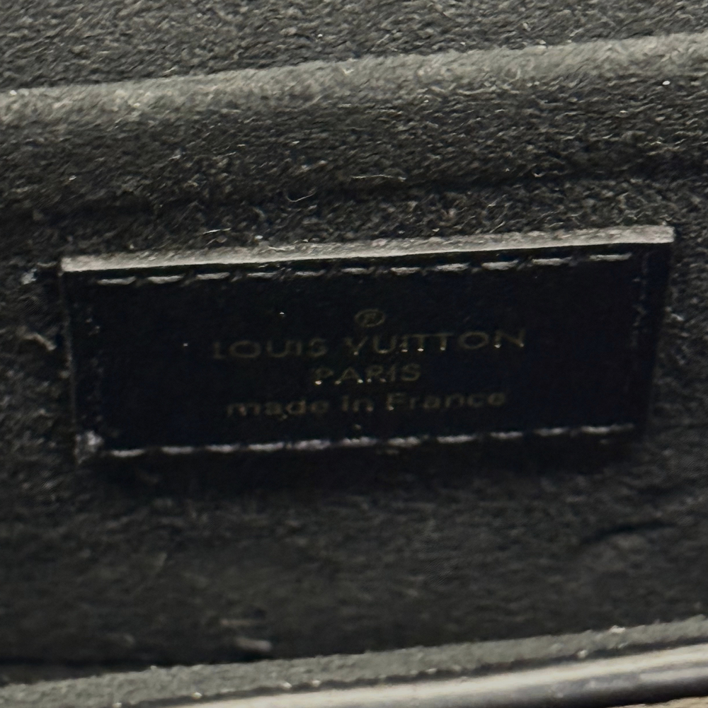 Interior stamp label reading Louis Vuitton and made in France