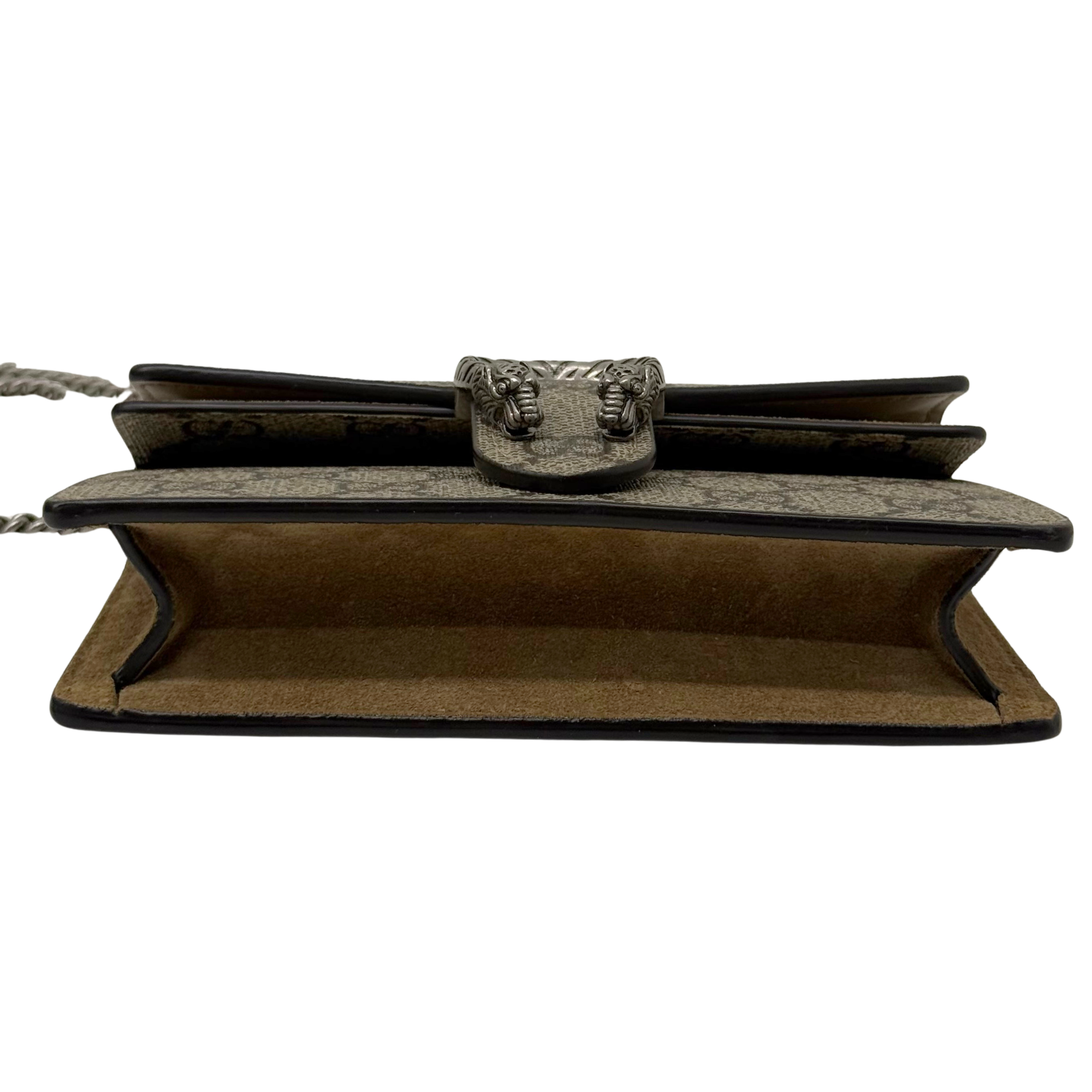 Gucci shoulder bag underside with embossed clasp detail and brown suede base