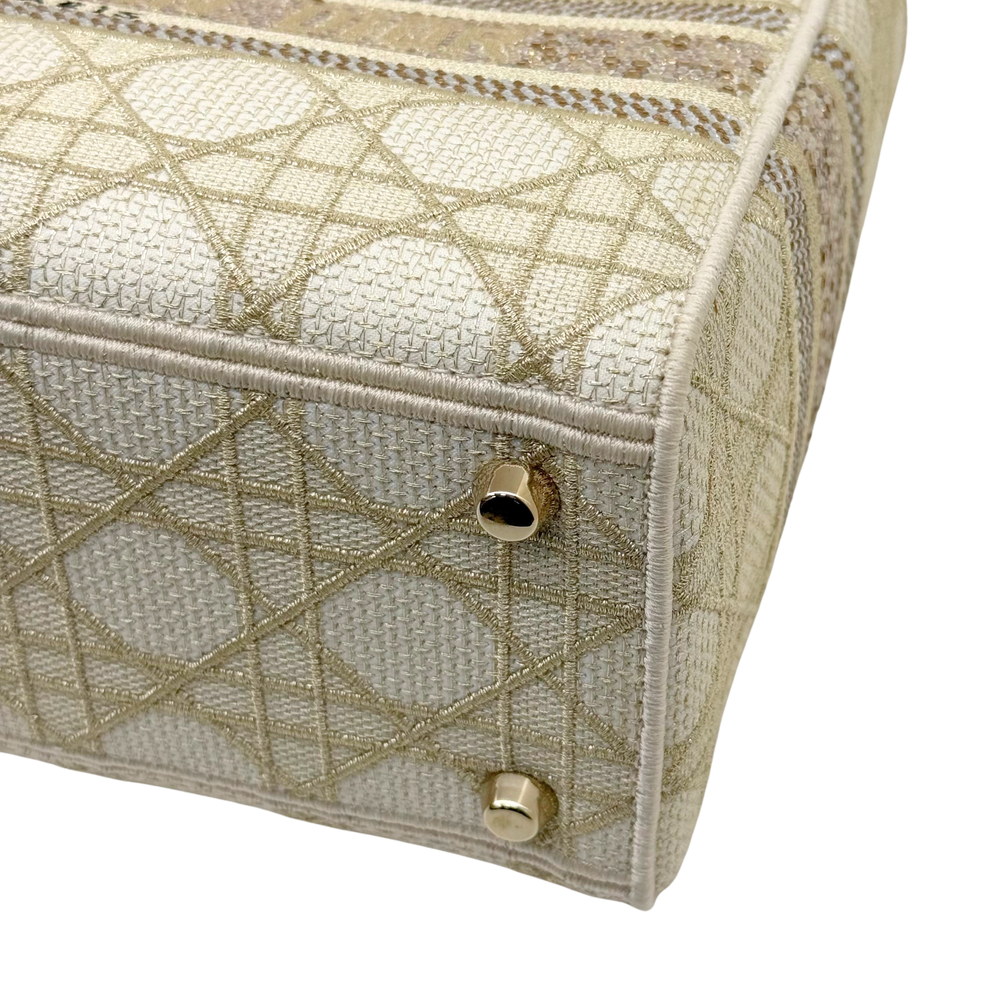 Christian Dior Medium Lady D-Lite bag close-up, front flap with gold-tone snap buttons