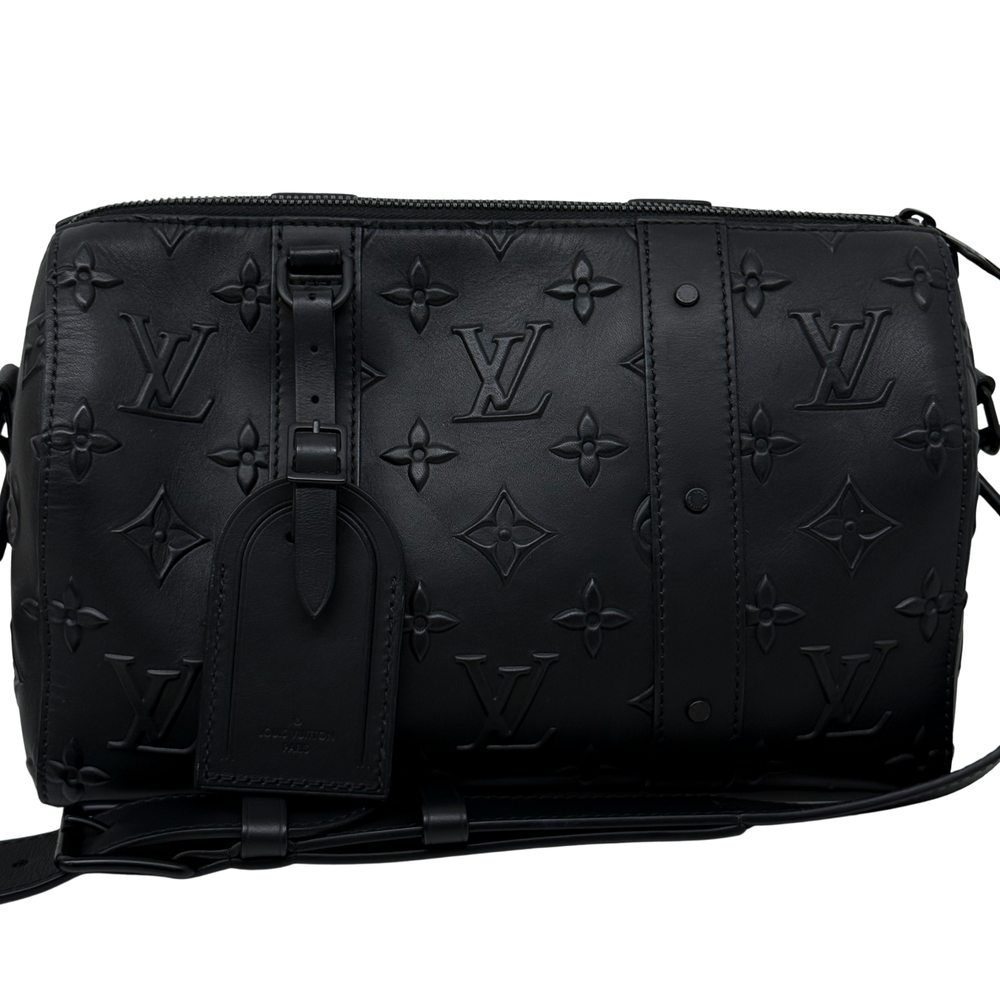 Black Louis Vuitton monogram crossbody bag with front patch and hanging strap detail
