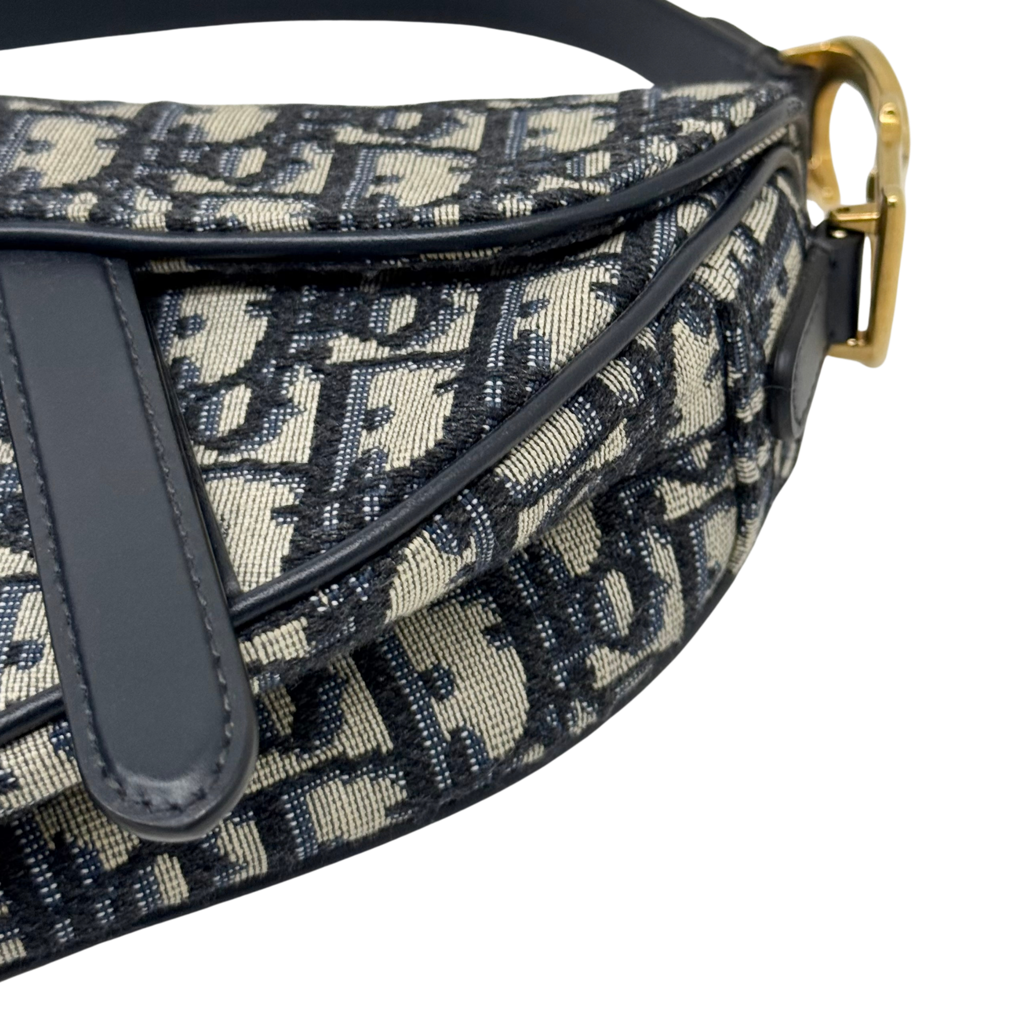 Mini bag front with black leather trim and stitched triangular panel detail