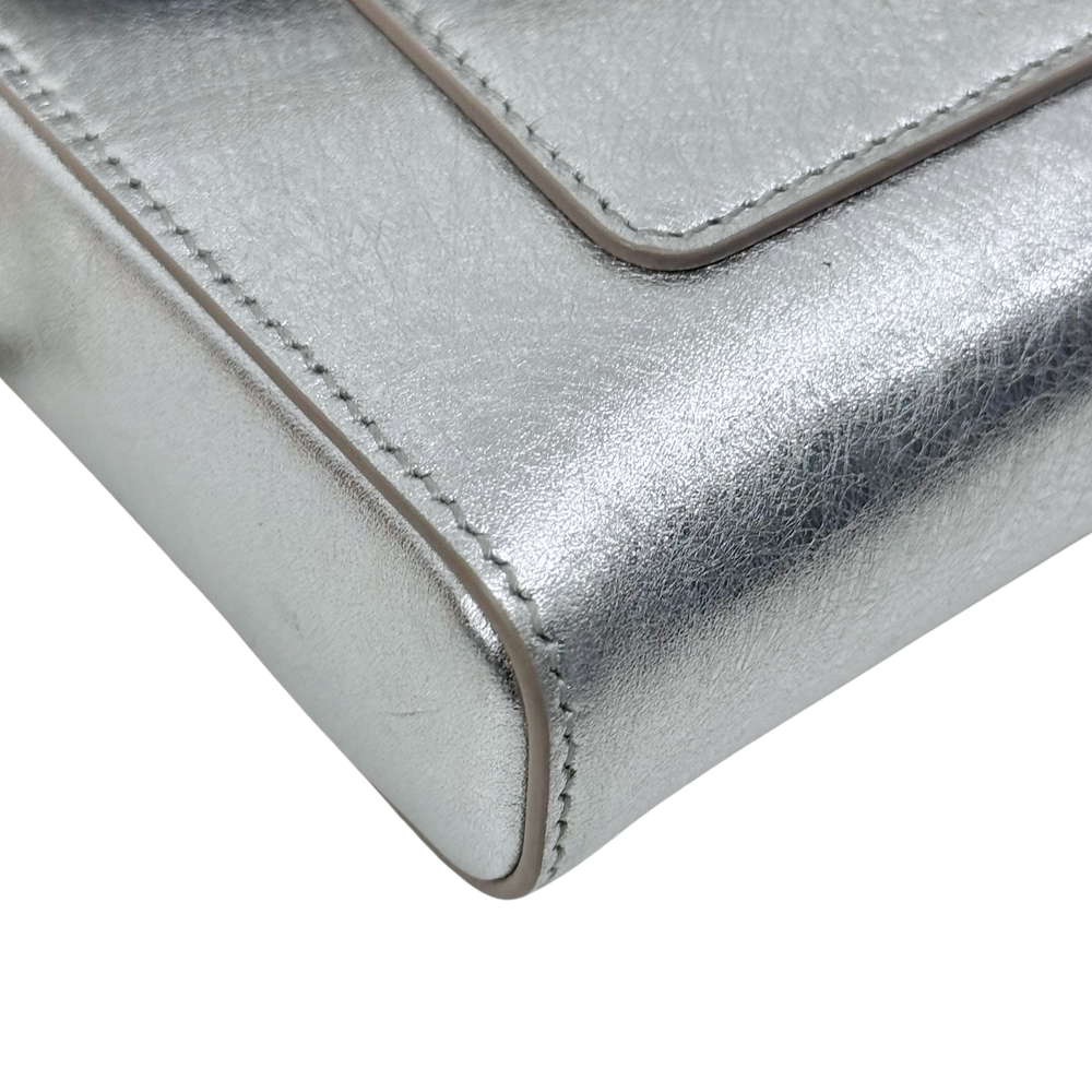Pre-owned Bulgari silver metallic leather corner with visible edge seam stitching detail