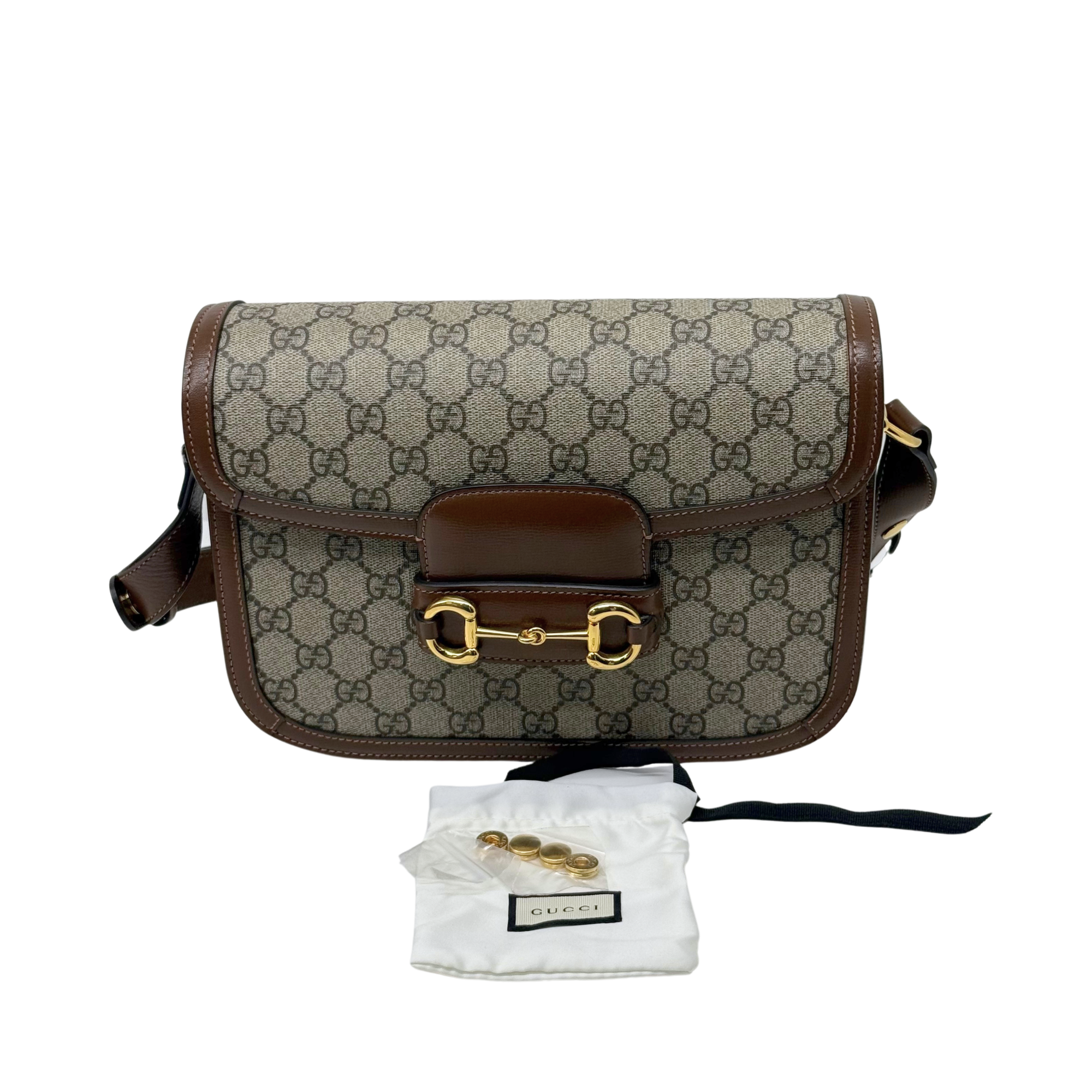 Pre-owned Gucci GG canvas shoulder bag with brown leather trim and front flap buckle