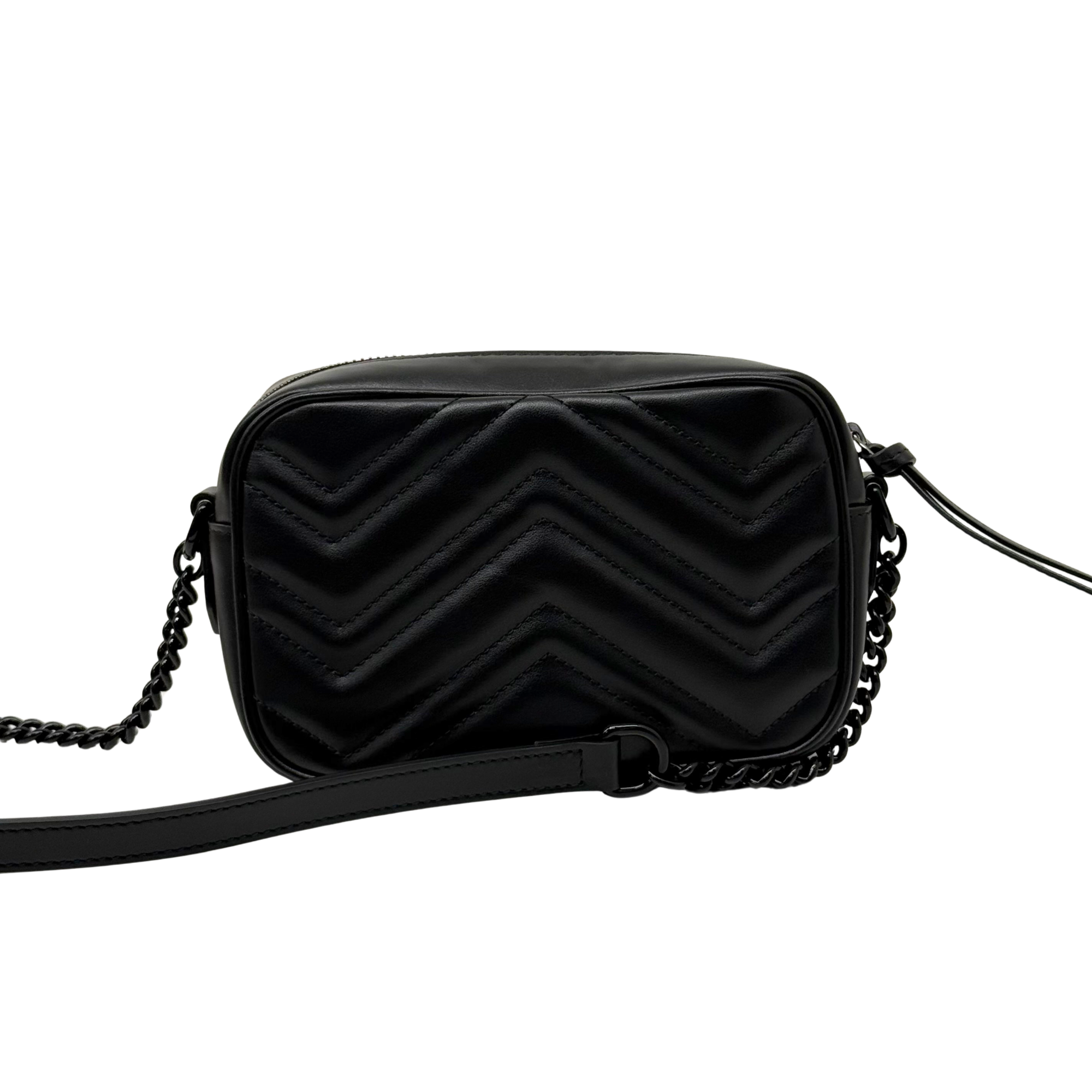 Black leather crossbody bag with chevron stitching and chain strap, front view.