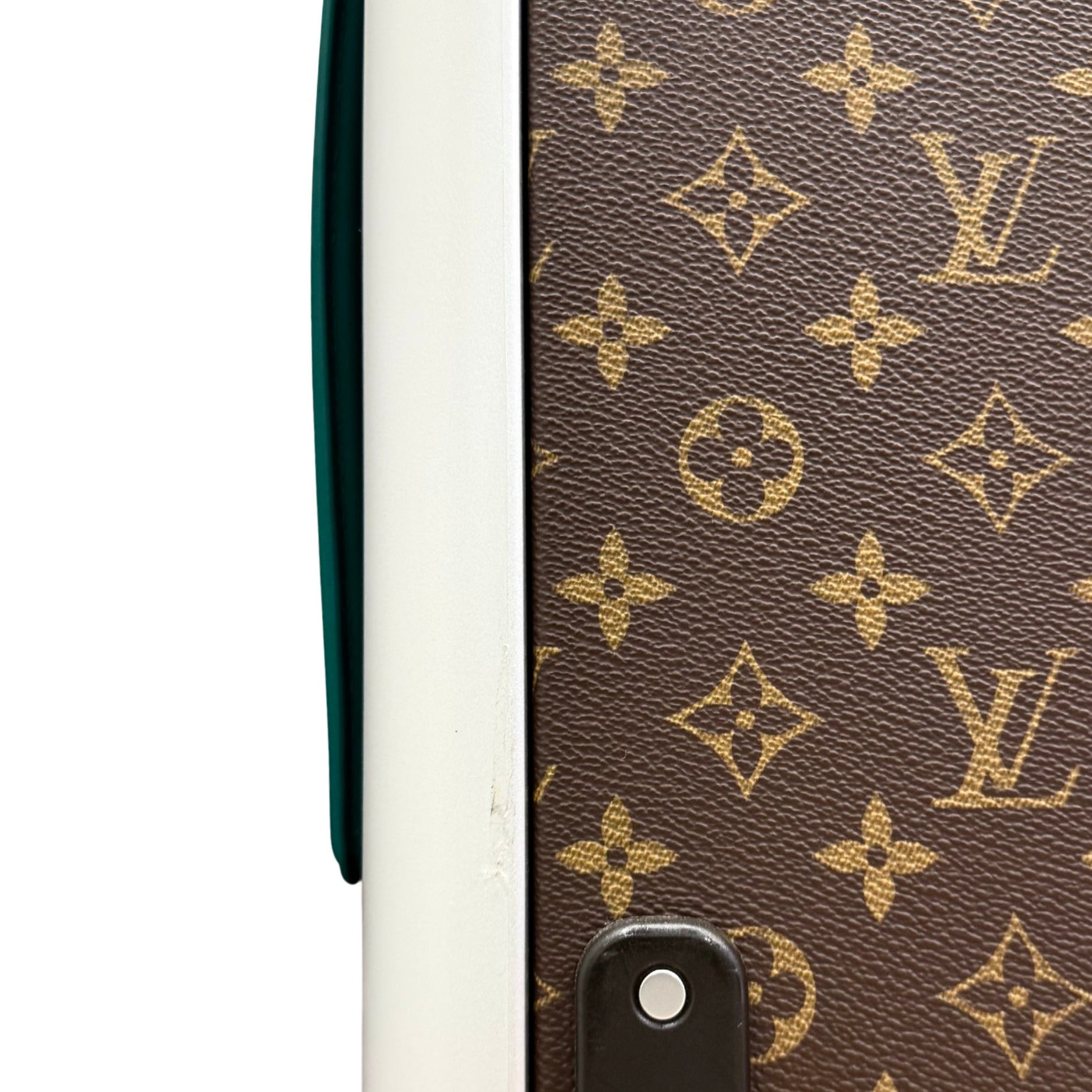 Pre-owned rolling suitcase side close-up, monogram canvas with teal strap and metal loop