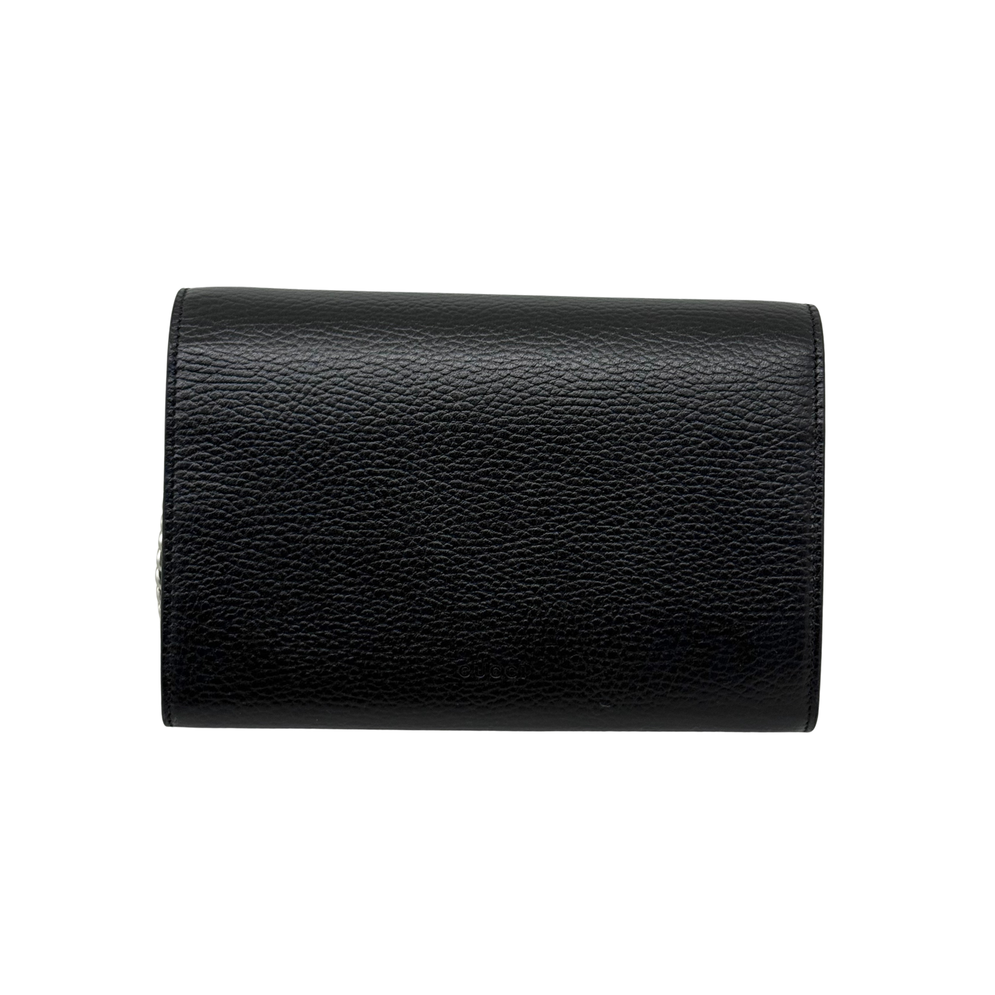 Gucci black leather clutch back panel, smooth textured finish