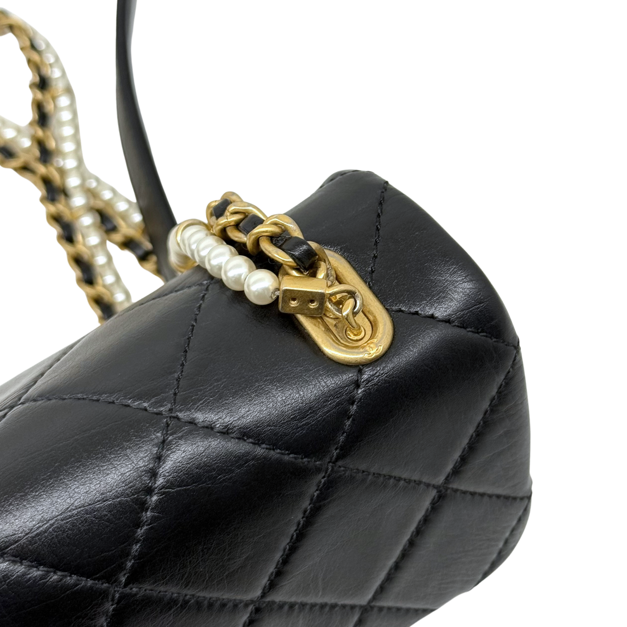 Chanel black bag with pearl strap
