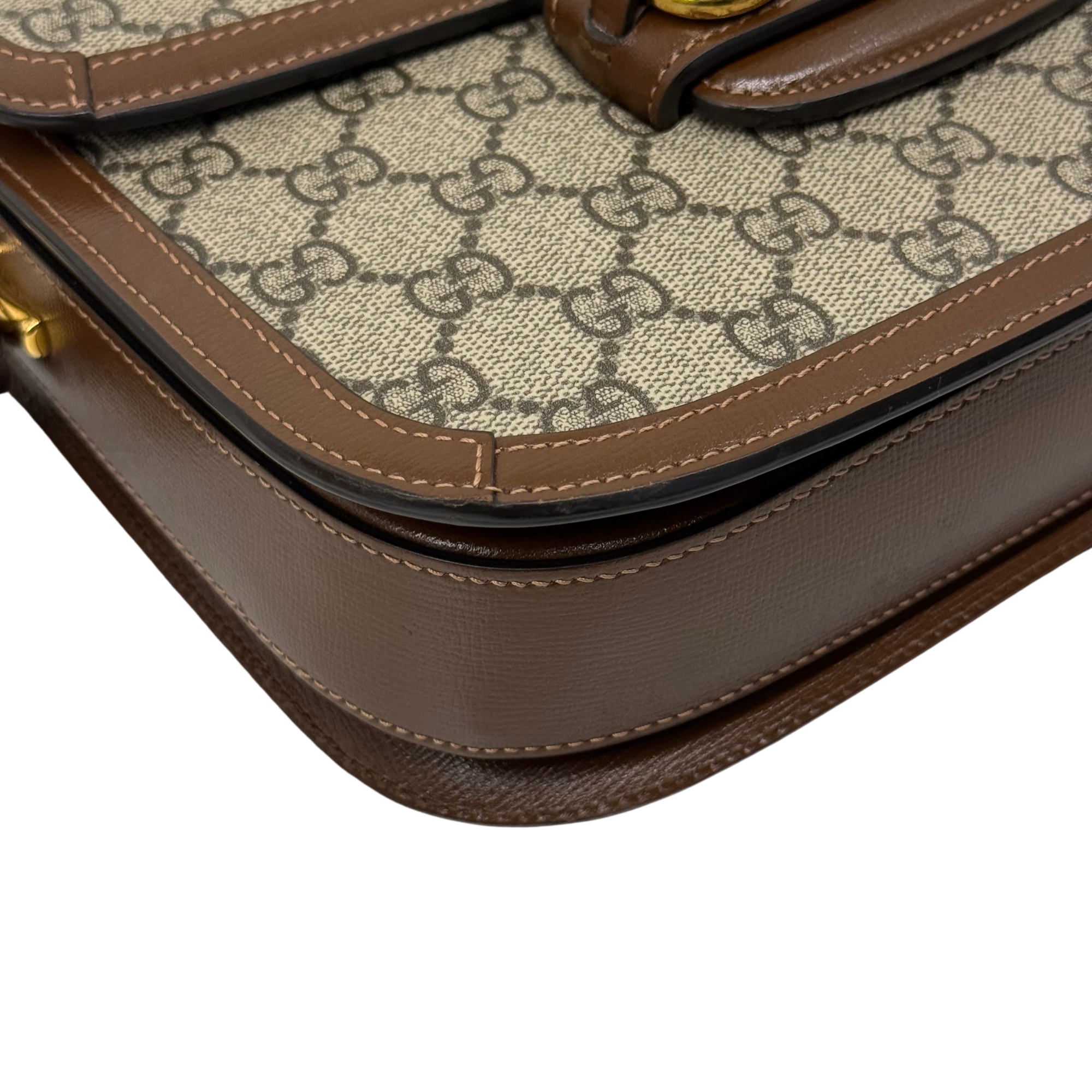Pre-owned Gucci bag front lower edge with stitched brown leather and GG canvas