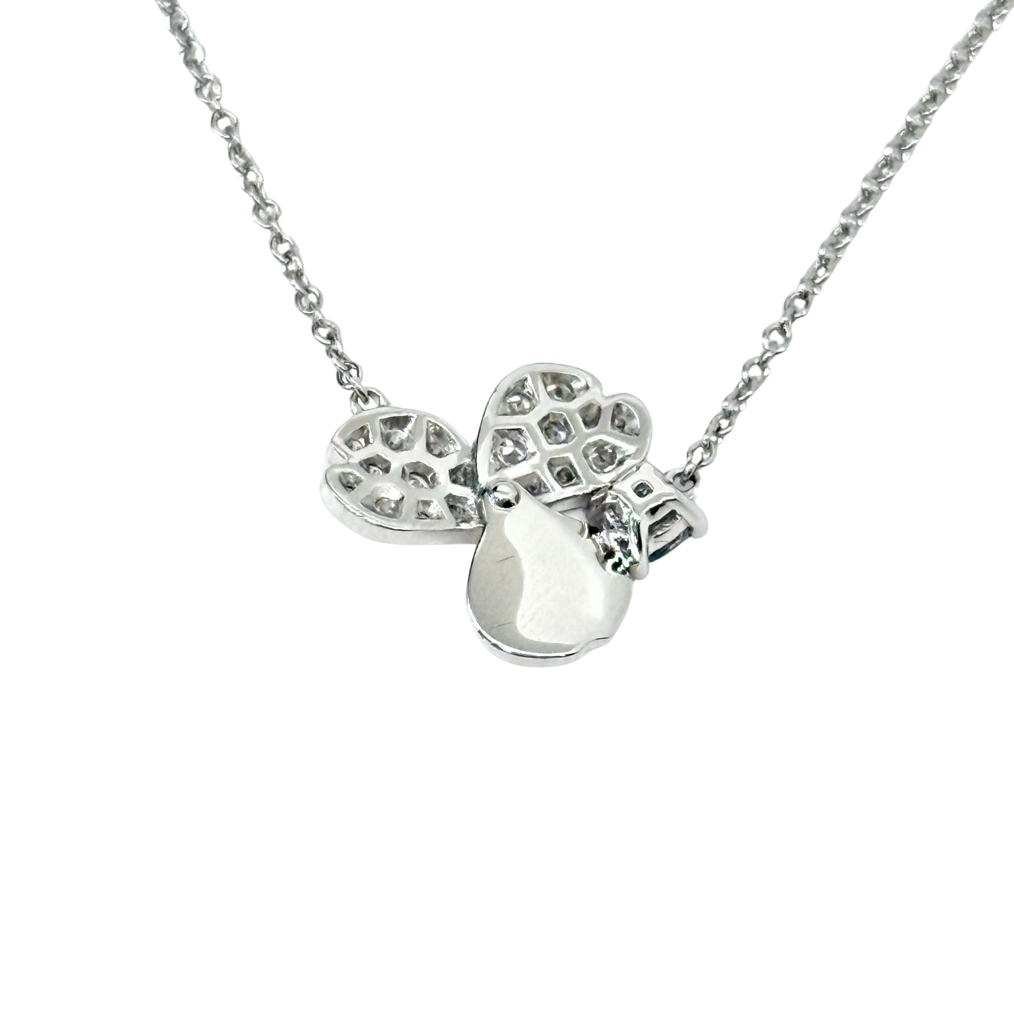 Silver-tone clover pendant necklace with four sparkling round-cut stones and hanging chain
