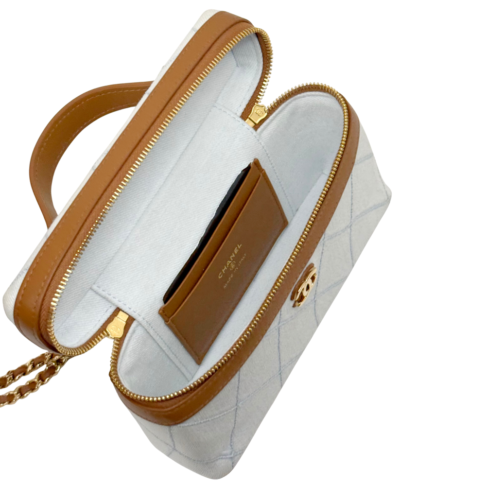 Chanel light-blue quilted mini handbag with brown leather trim and gold-tone zip