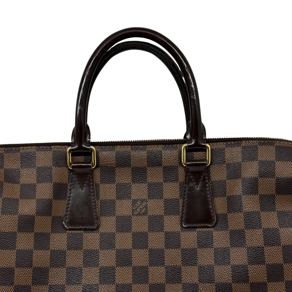 Pre-owned Louis Vuitton checkered handbag top with two leather handle straps and metal rings