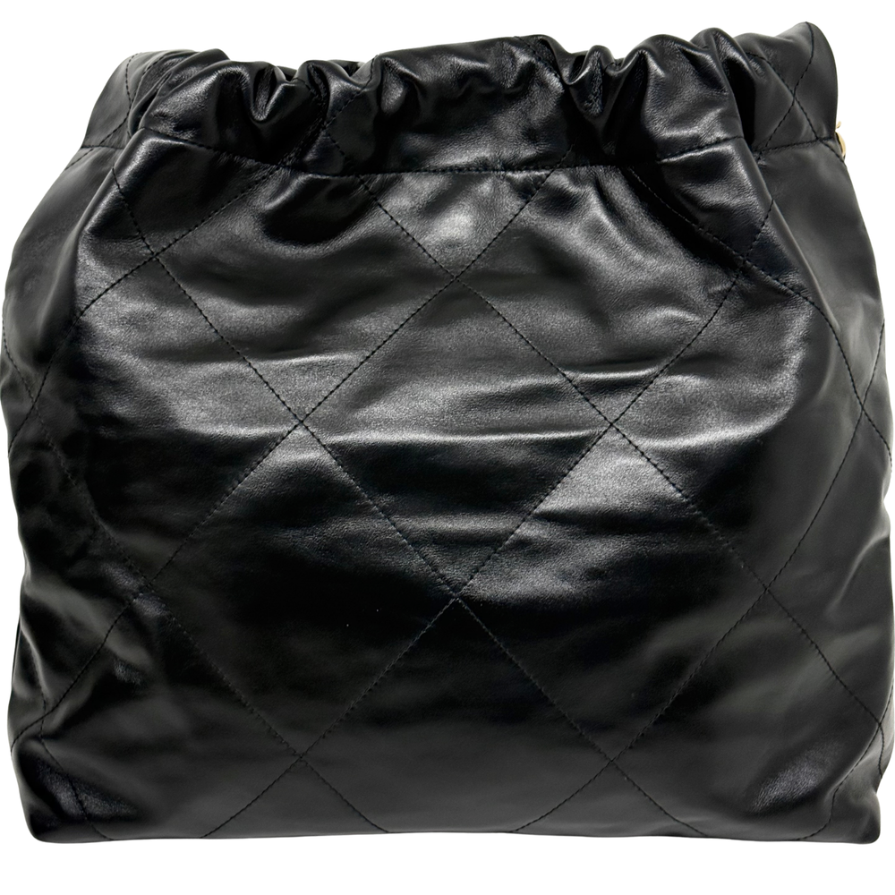 Black quilted leather Chanel drawstring bag with diamond stitch pattern and ruched top