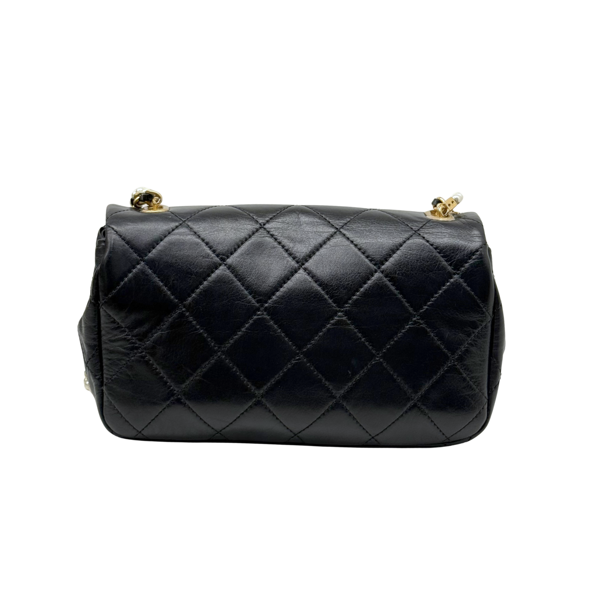 Chanel black bag with pearl strap