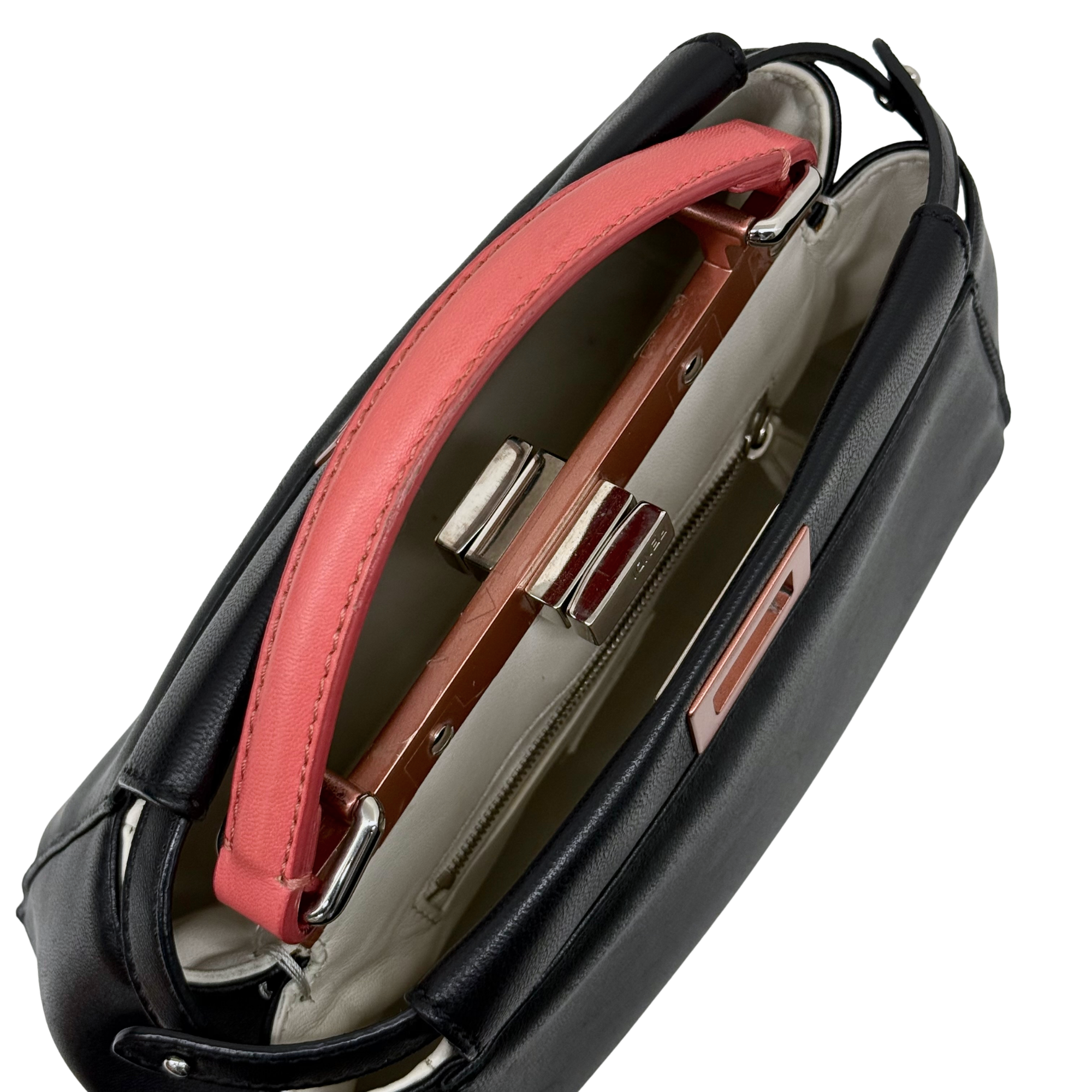 Pre-owned Fendi black leather handbag, coral-pink handles, open interior with strap hardware
