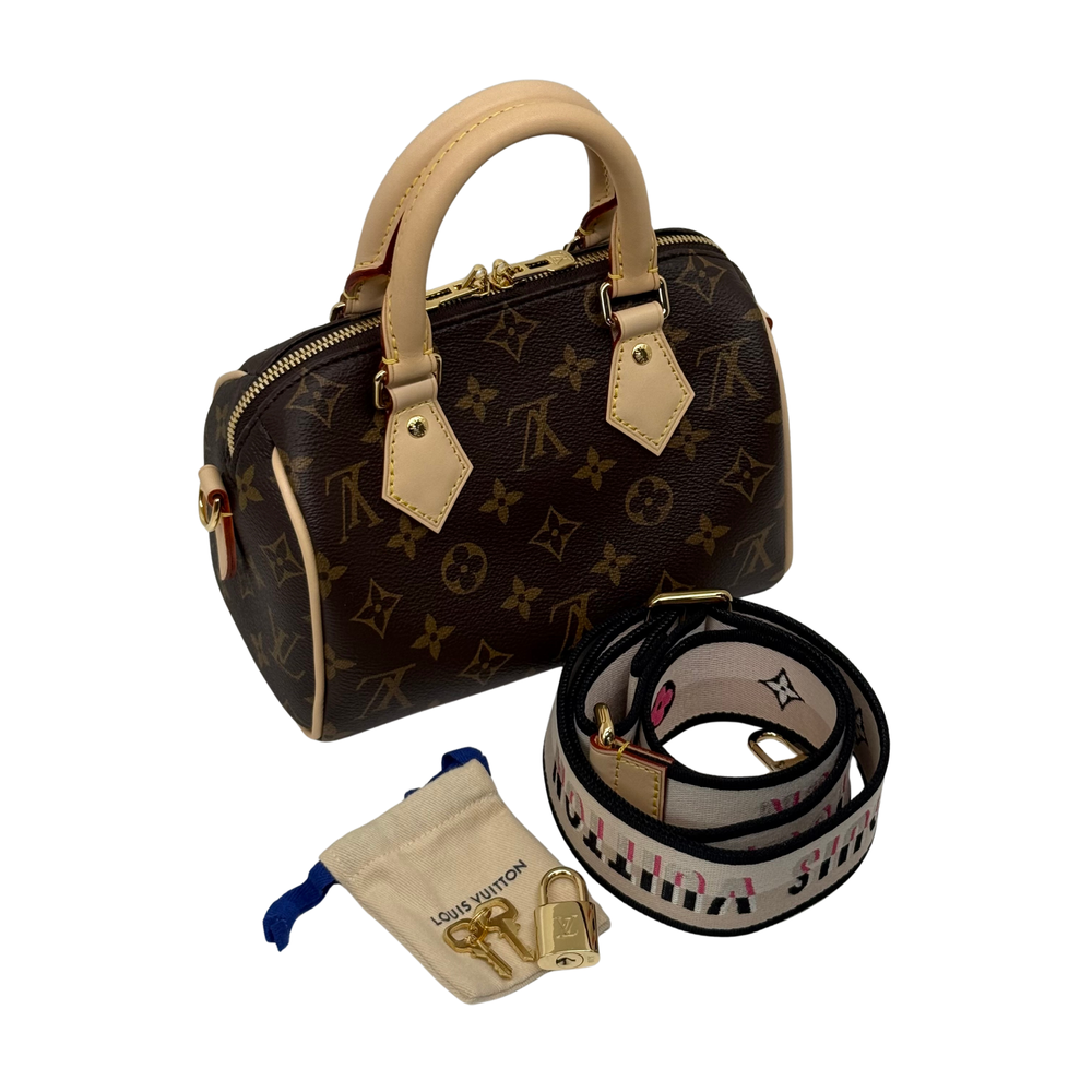 Louis Vuitton monogram mini handbag with top handles and removable strap