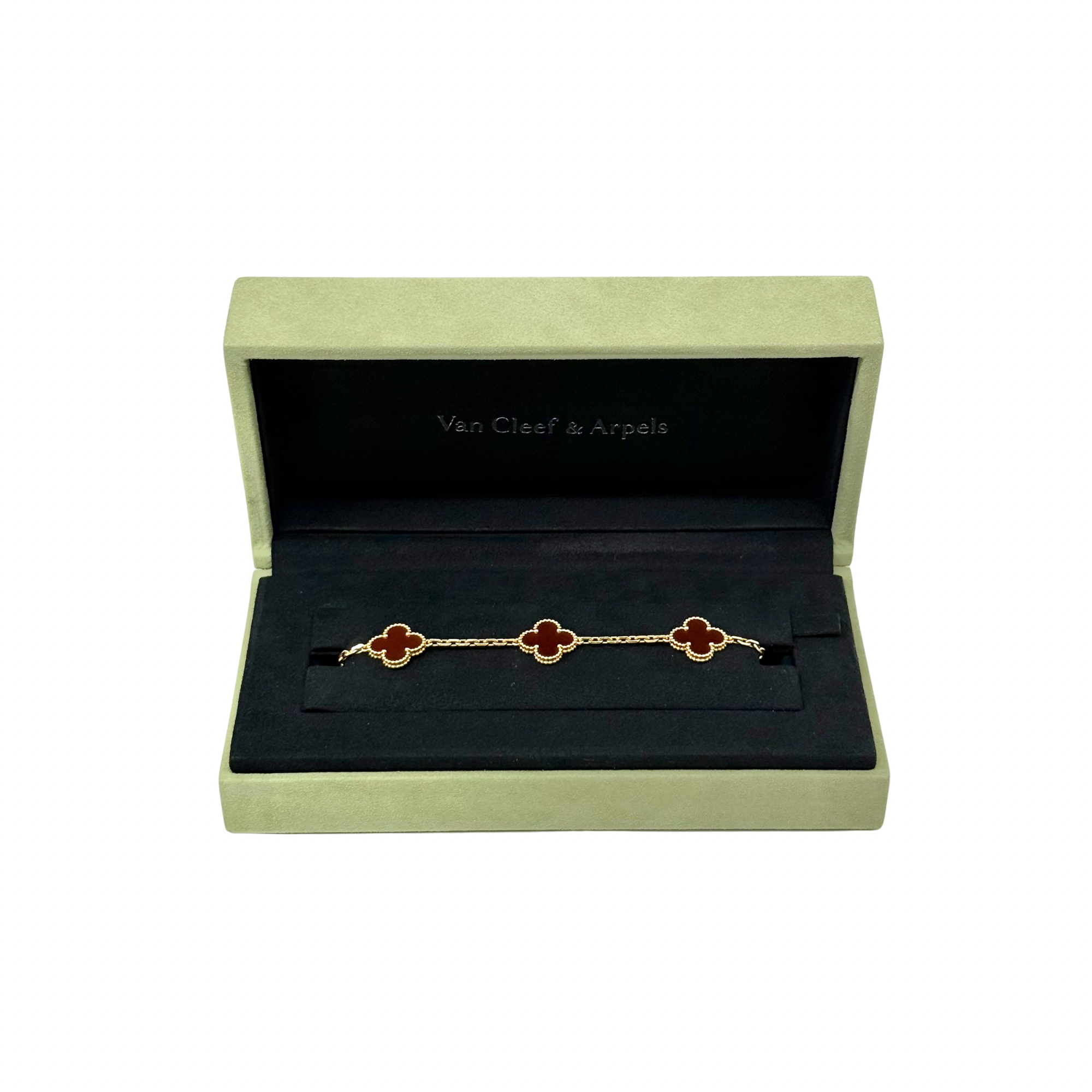 Goldtone clover bracelet with five red enamel motifs in jewelry box