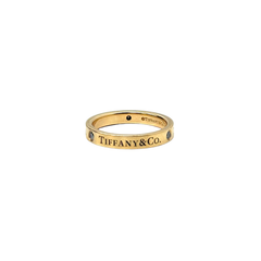 Pre-owned Tiffany & Co. yellow gold ring band with blue stone and engraved lettering