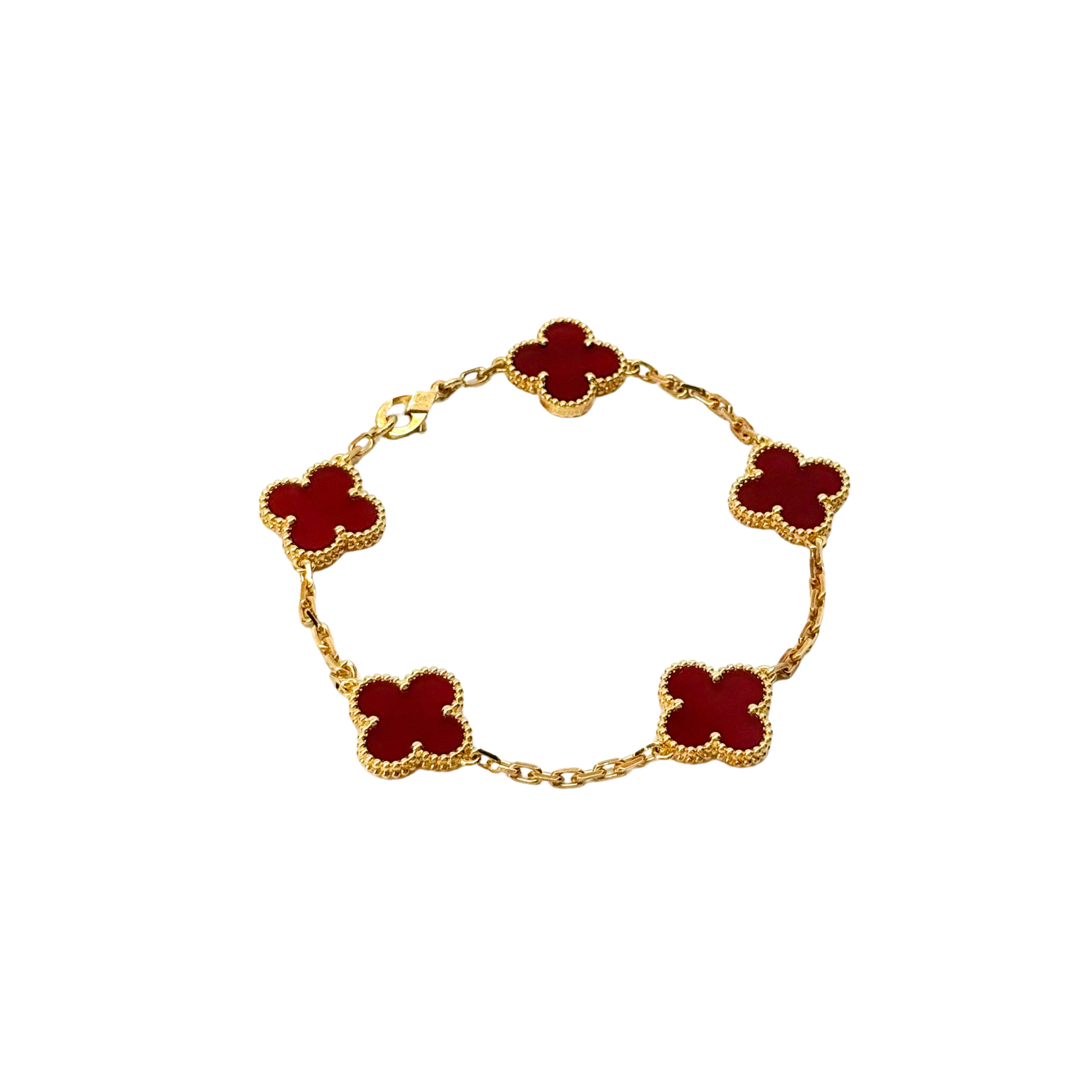 Gold bracelet with five red quatrefoil charms and openwork border