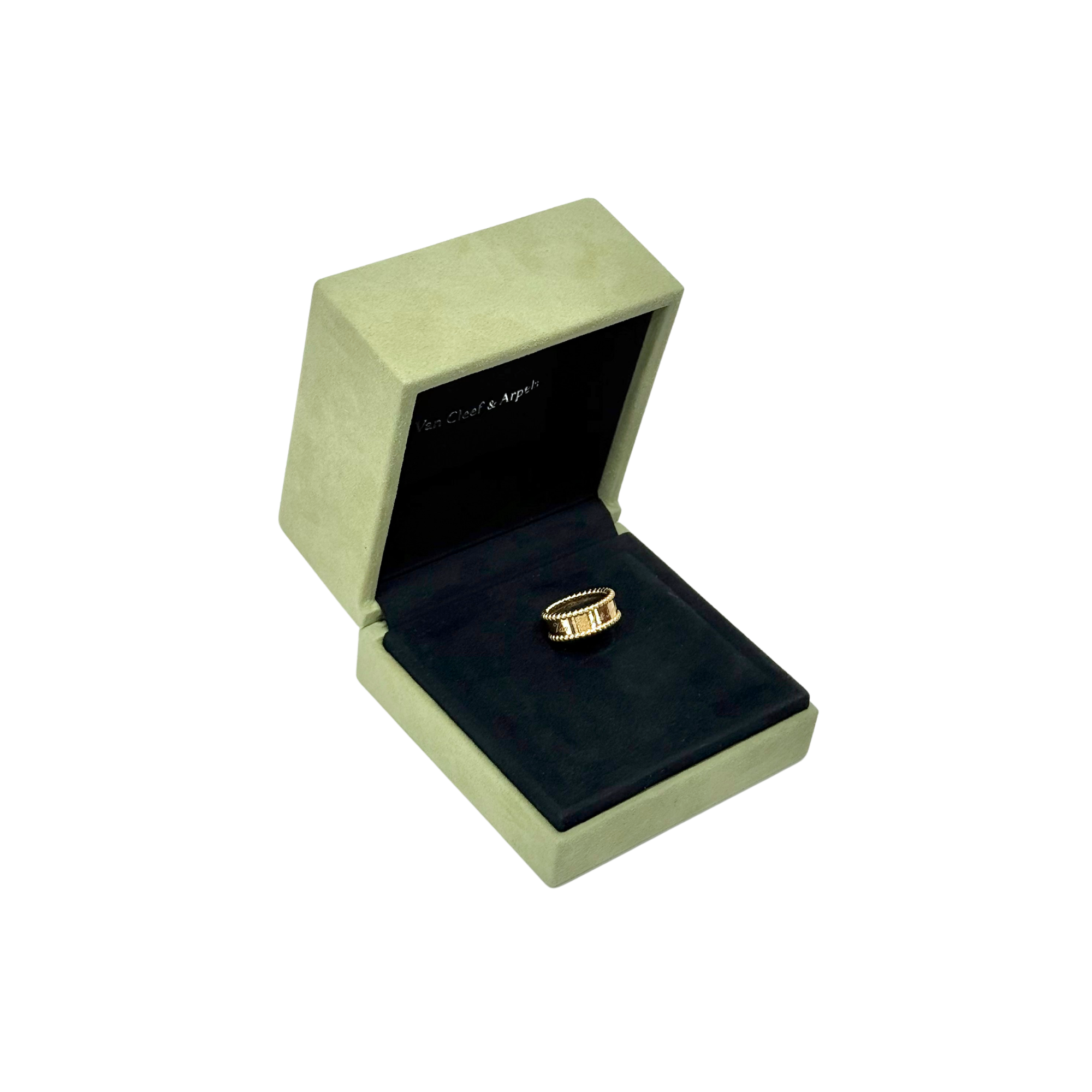 Gold-tone Van Cleef & Arpels ring resting in open presentation box