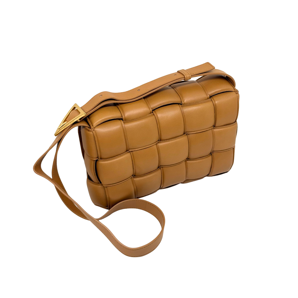 Tan leather crossbody bag with braided-look strap and woven cassette panel design