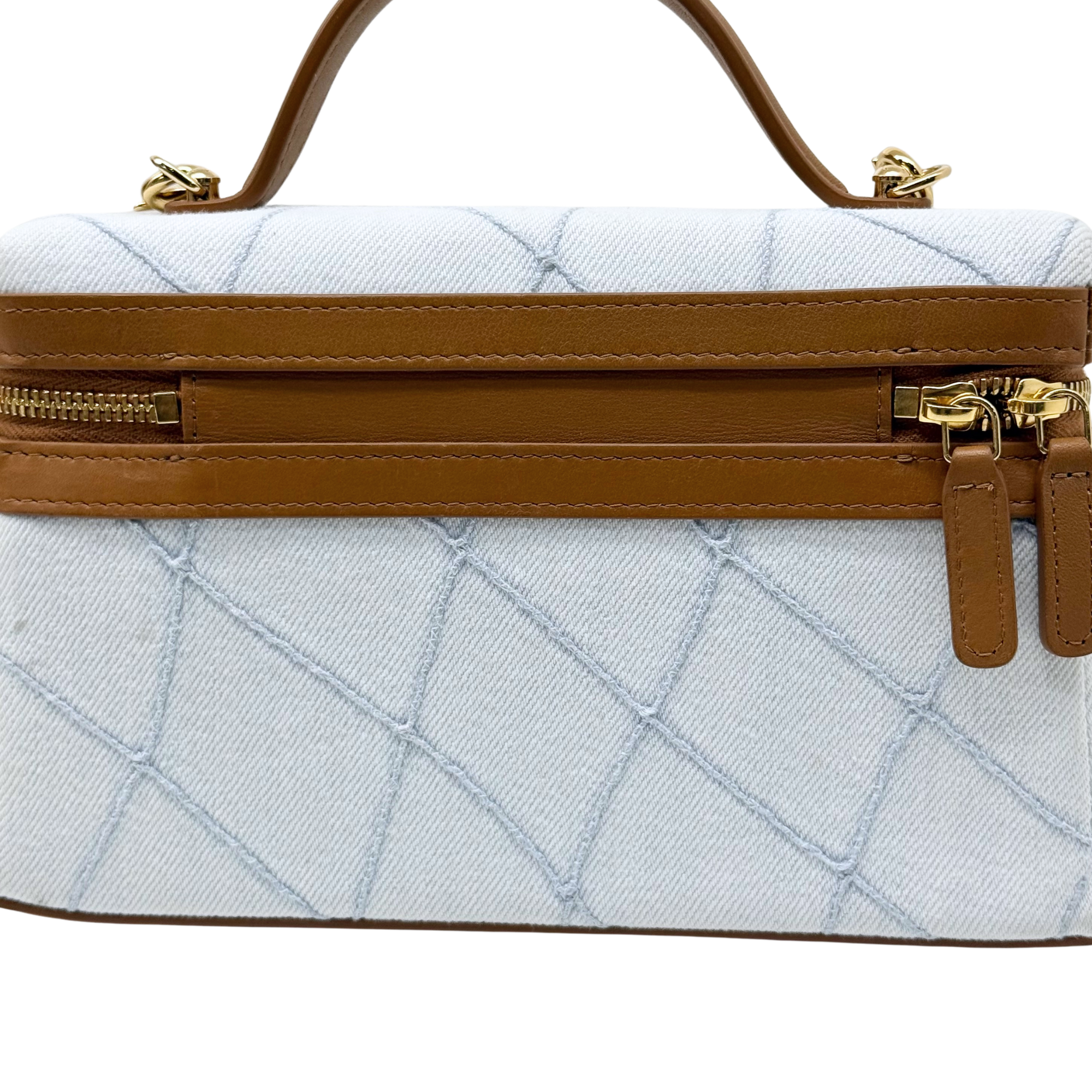Chanel light-blue quilted front view with brown zip band and hanging zip pulls