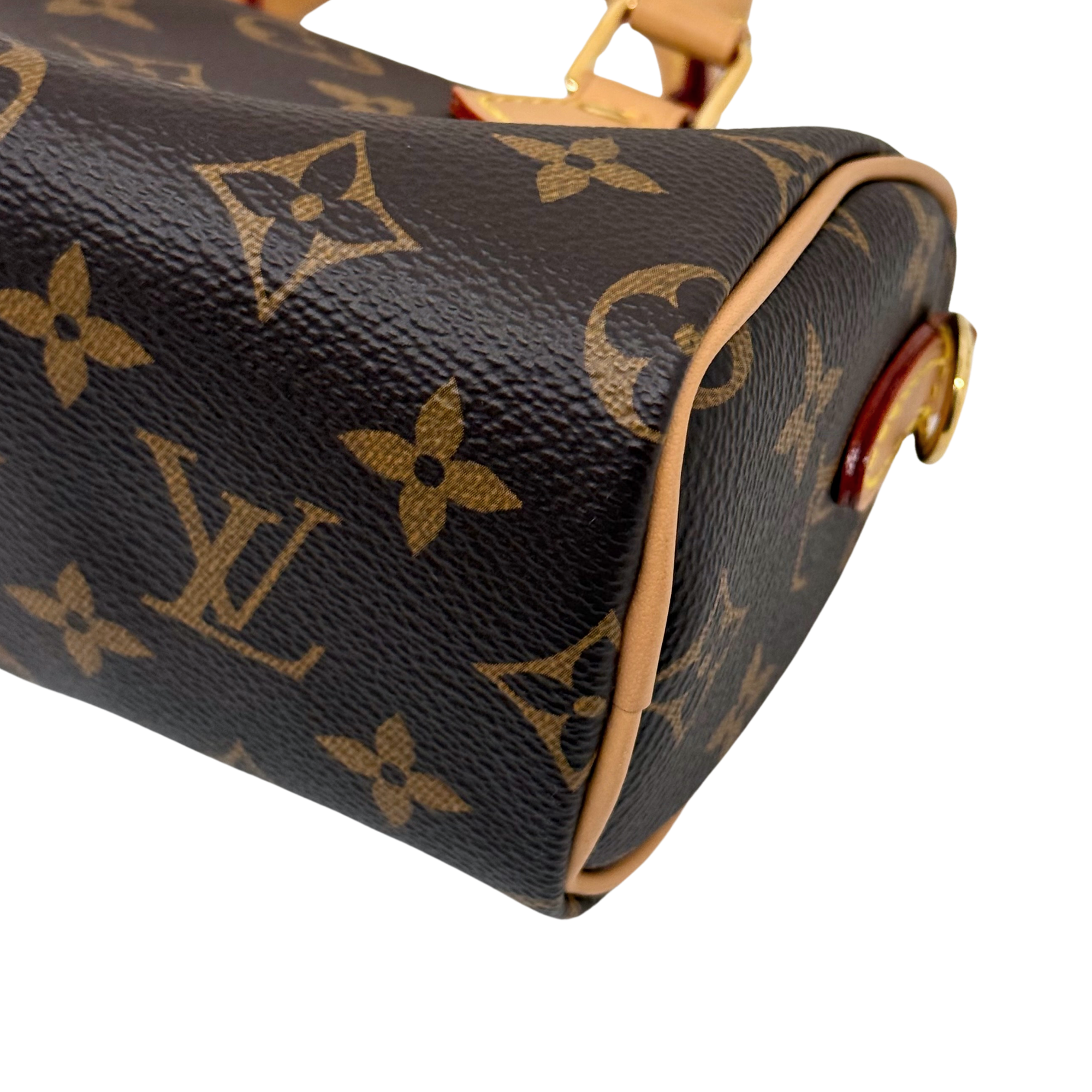 Louis Vuitton monogram canvas handbag corner with tan piping and metal ring