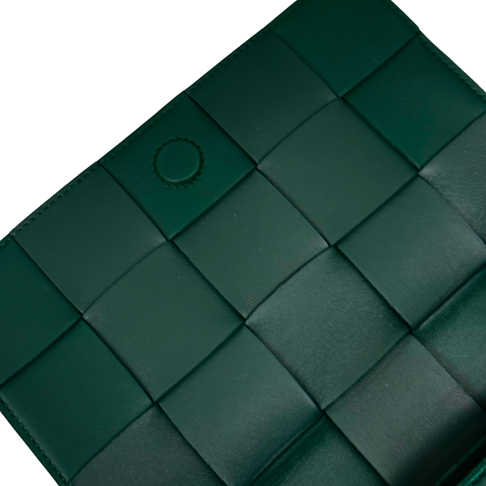 Green leather woven panel design with circular snap details