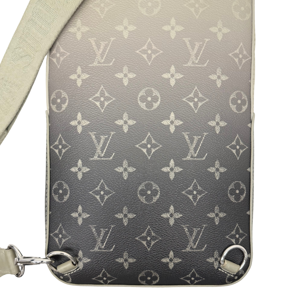 Pre-owned crossbody bag front panel with repeating monogram pattern and beige edging
