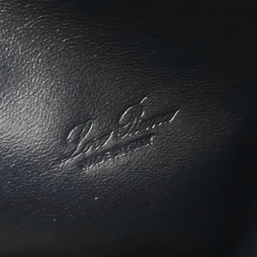 Black pebbled leather texture close-up