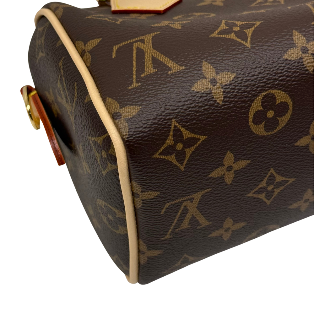 Louis Vuitton monogram handbag corner with light leather edge and side hardware