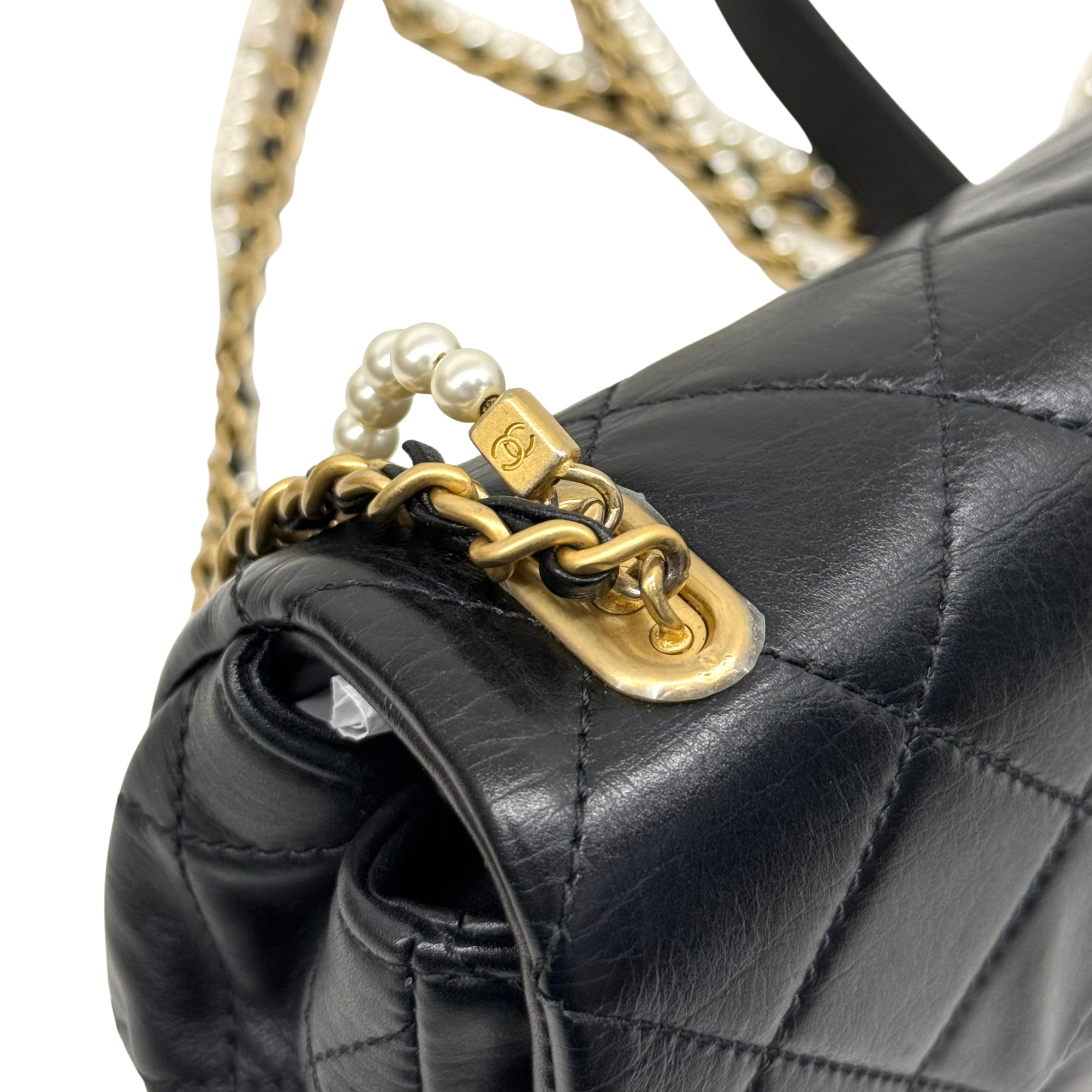 Chanel black bag with pearl strap