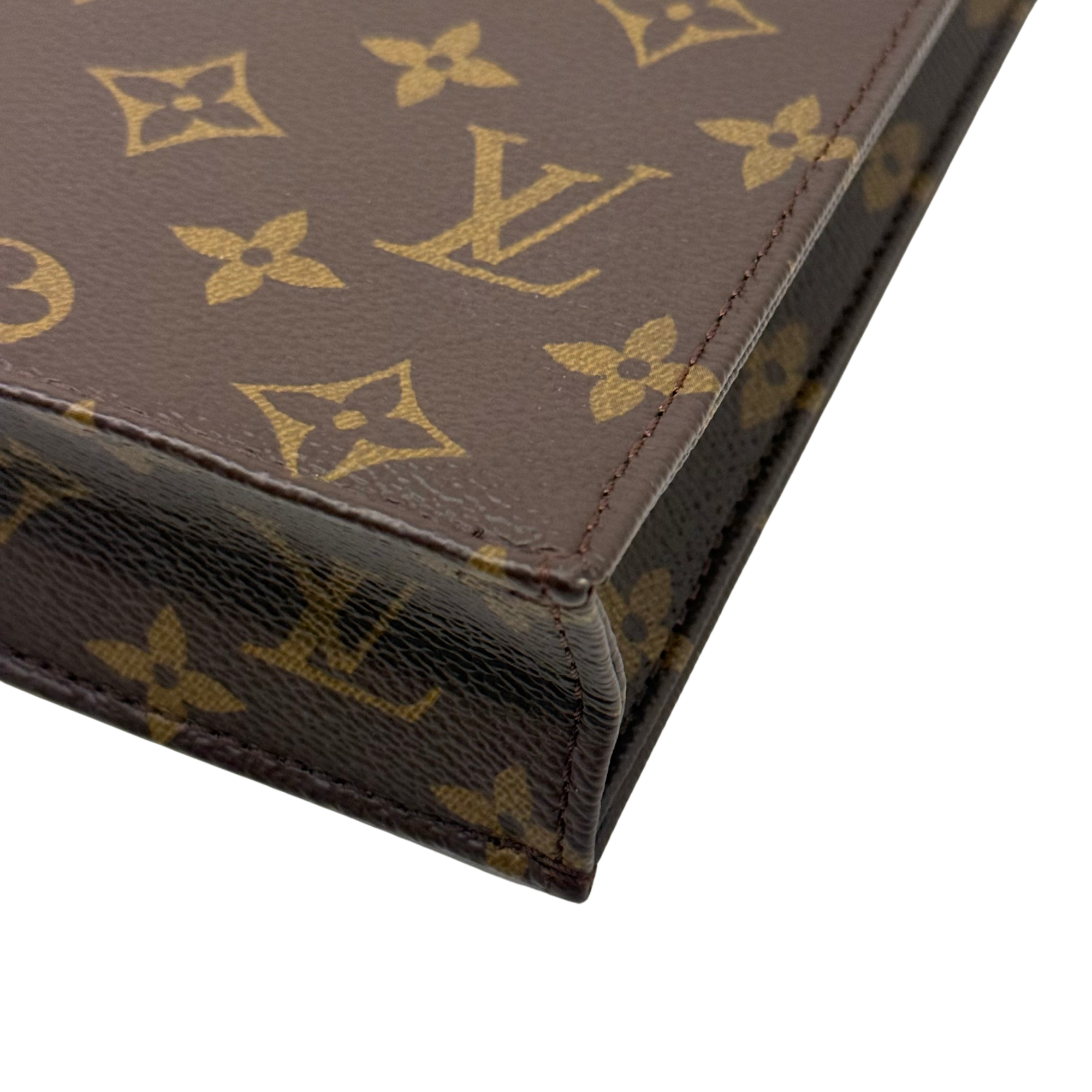 Pre-owned Louis Vuitton monogram handbag corner detail with stitched edging and textured trim