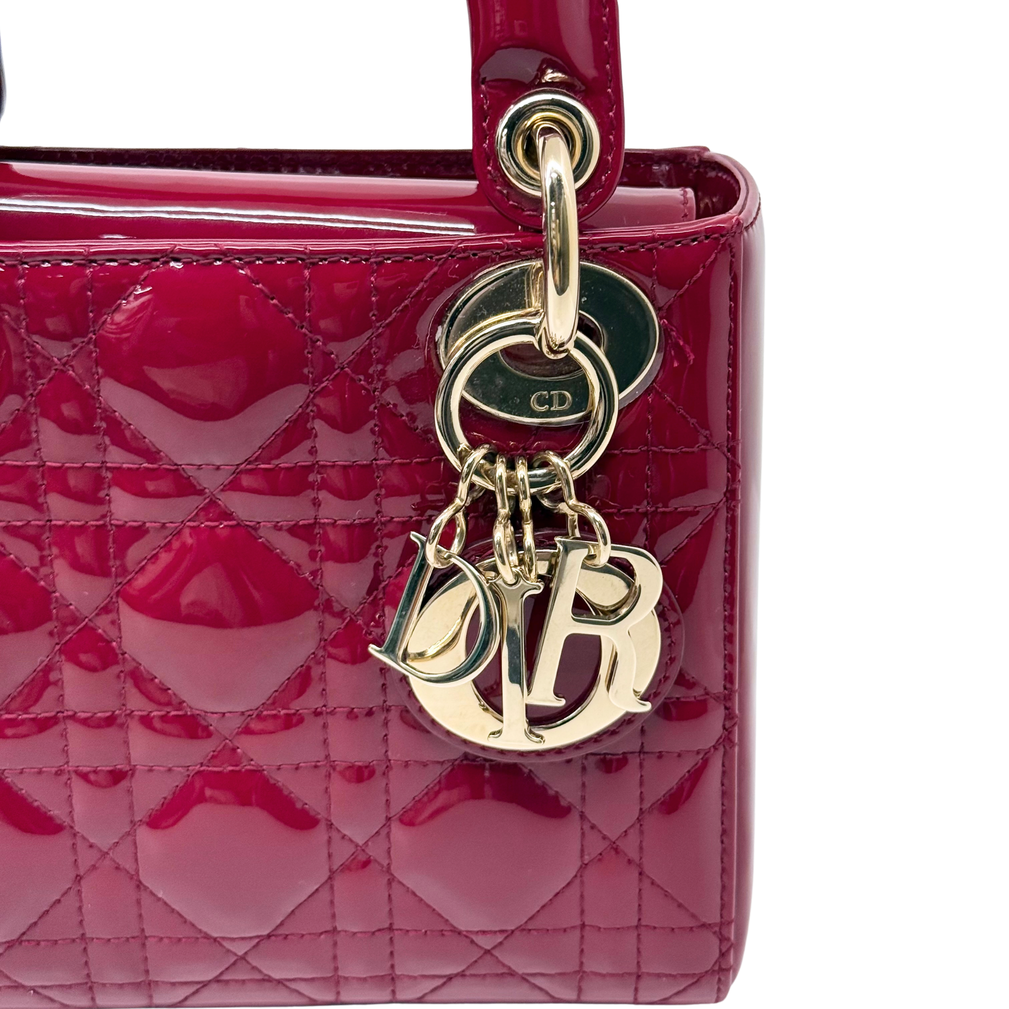 Red quilted patent leather mini handbag with gold CD logo charm and chain hardware